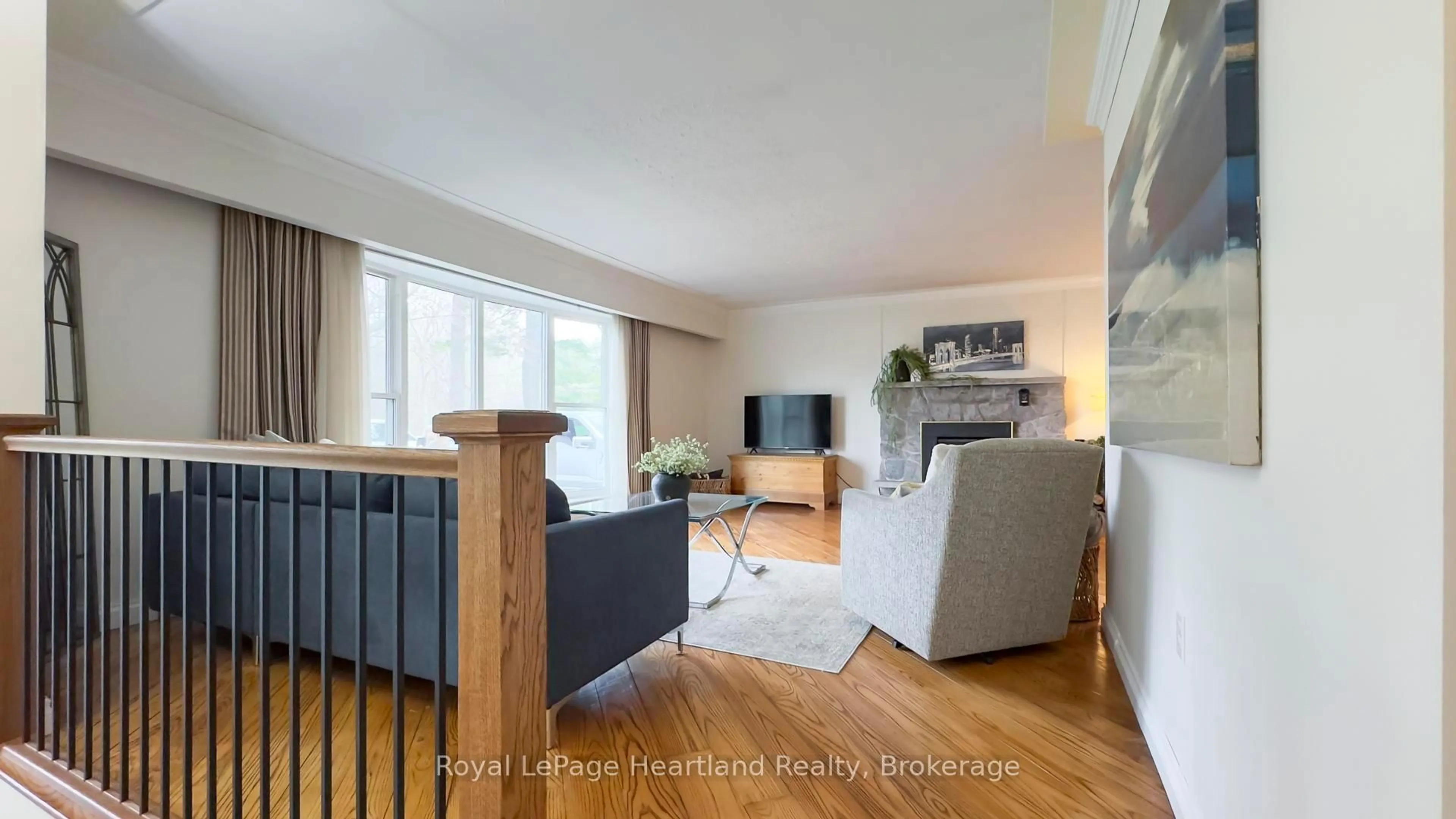 Living room with furniture, wood/laminate floor for 41829 Amberley Rd, Morris Turnberry Ontario N0G 1G0