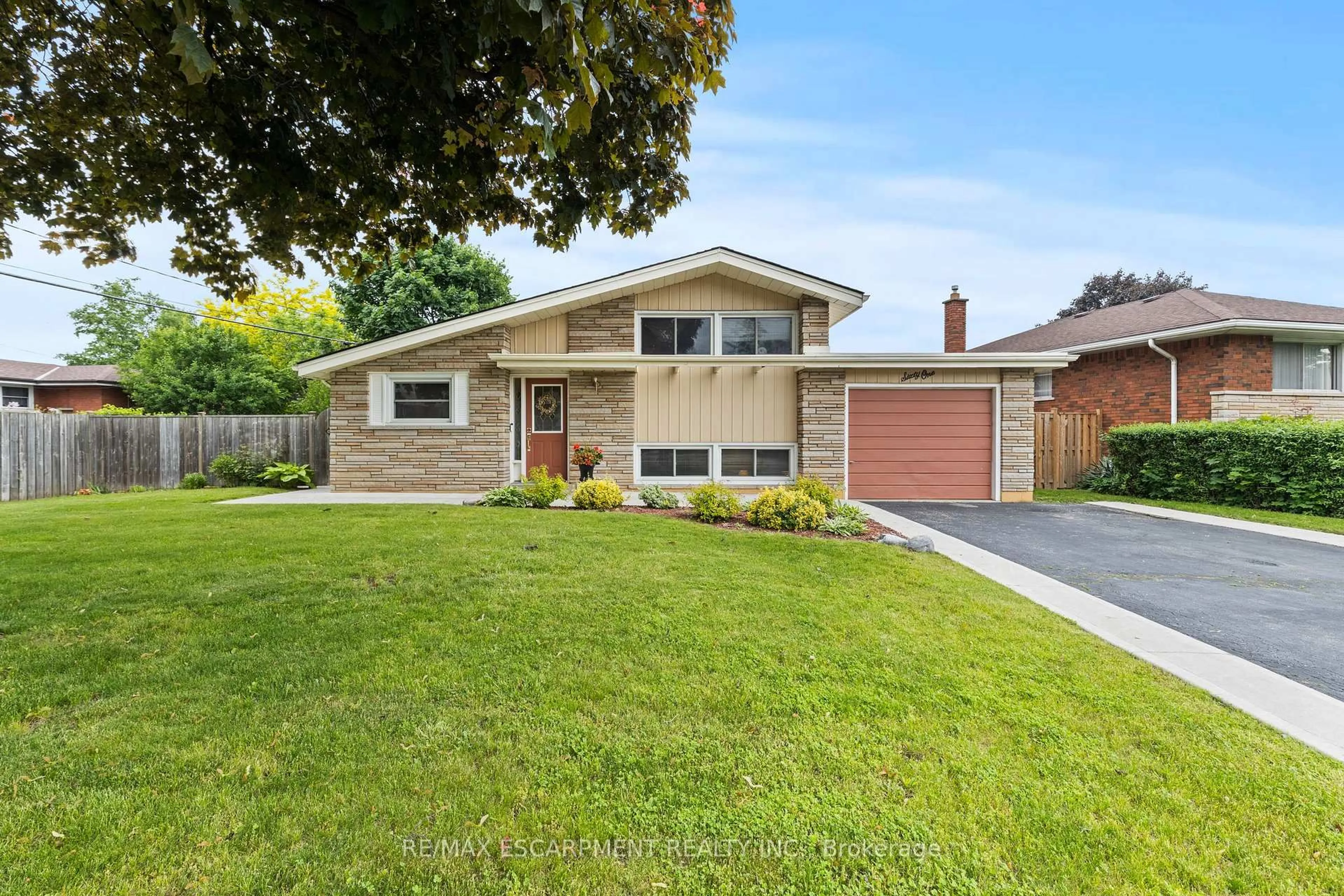 Home with brick exterior material, street for 61 Orphir Rd, Hamilton Ontario L8K 3Z3