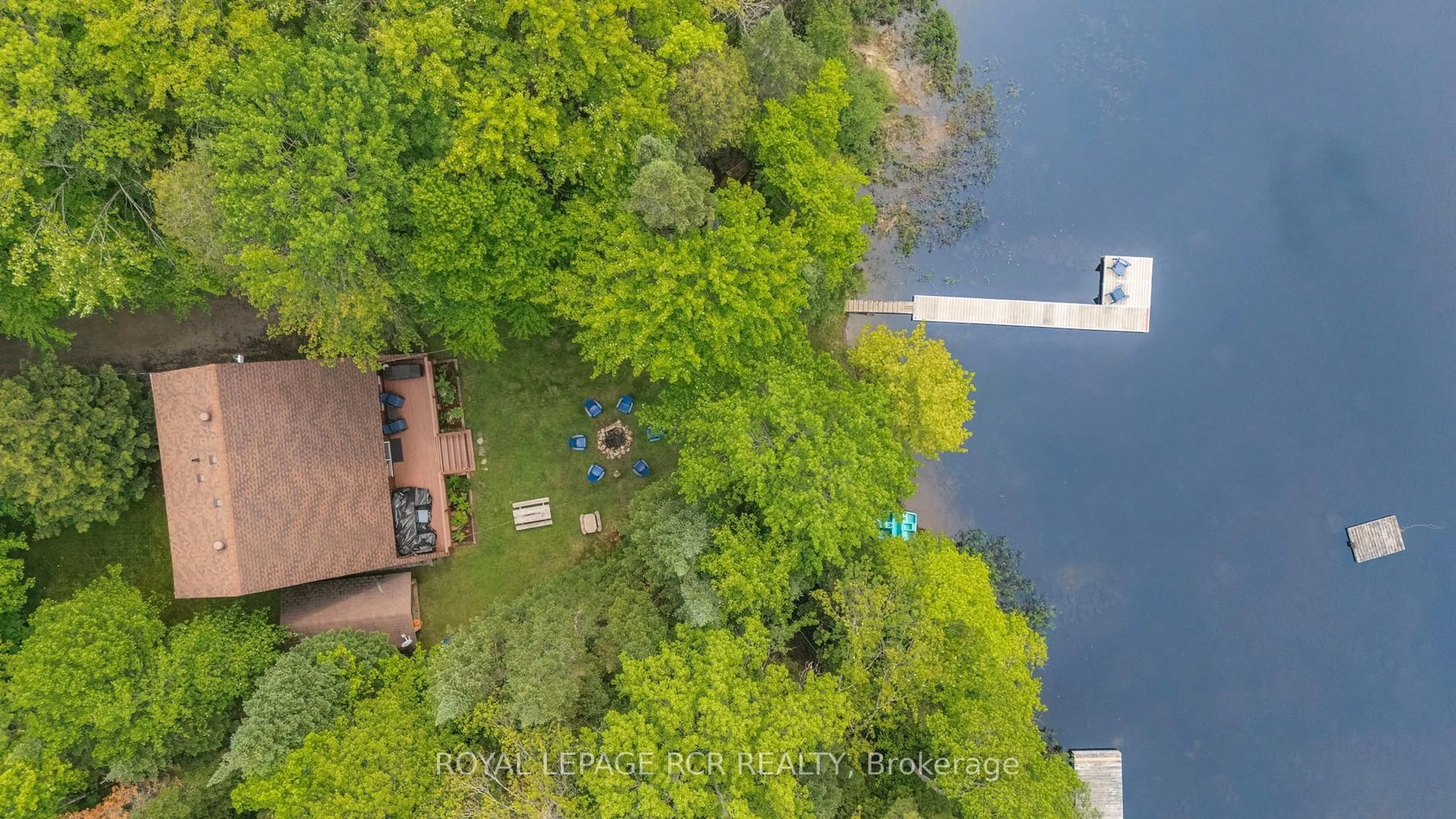 A pic from outside/outdoor area/front of a property/back of a property/a pic from drone, water/lake/river/ocean view for 1034 Bird Lake Cres, Bracebridge Ontario P1L 1X1