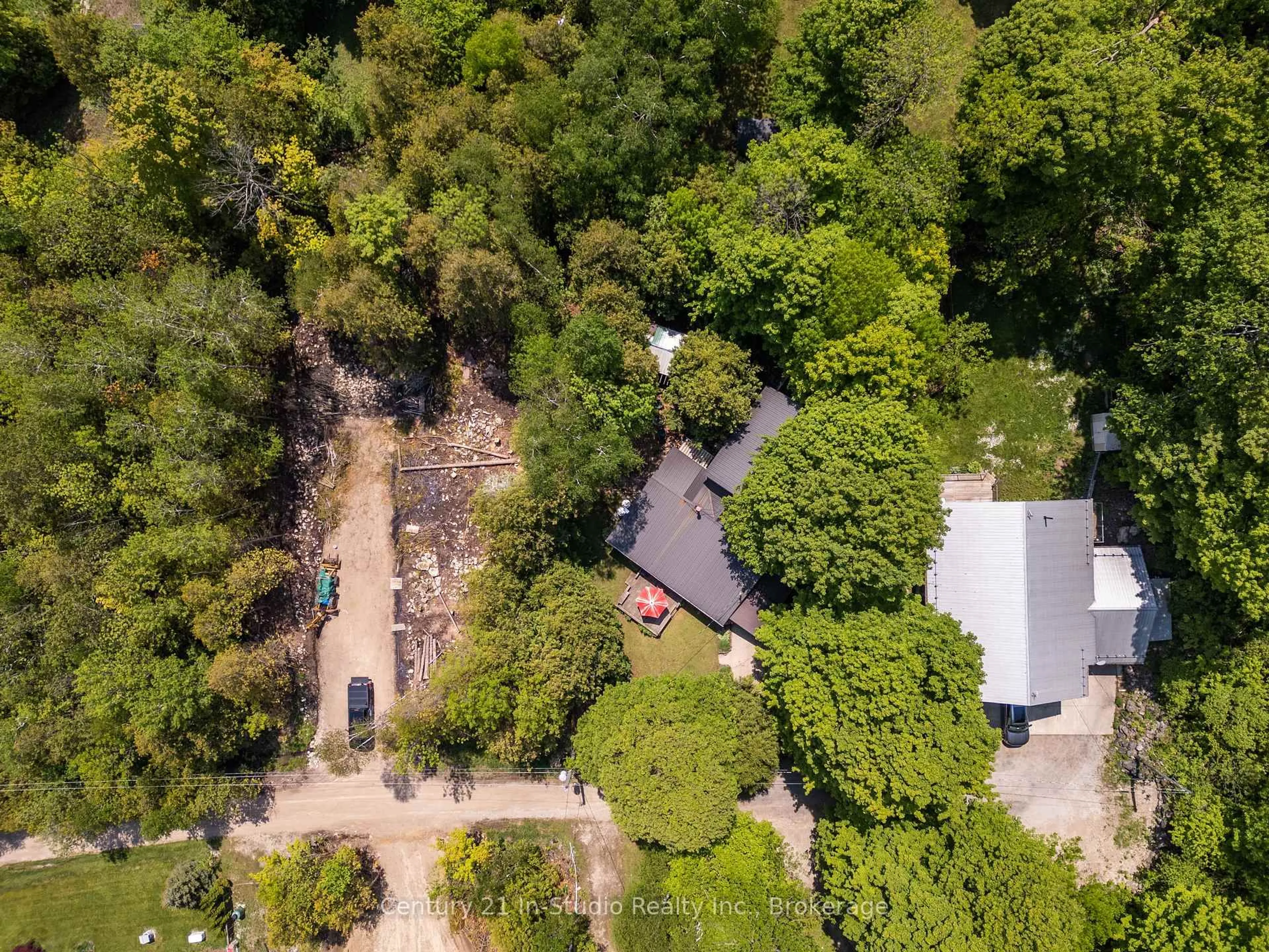 A pic from outside/outdoor area/front of a property/back of a property/a pic from drone, forest/trees view for 9 13th Ave, South Bruce Peninsula Ontario N0H 2T0