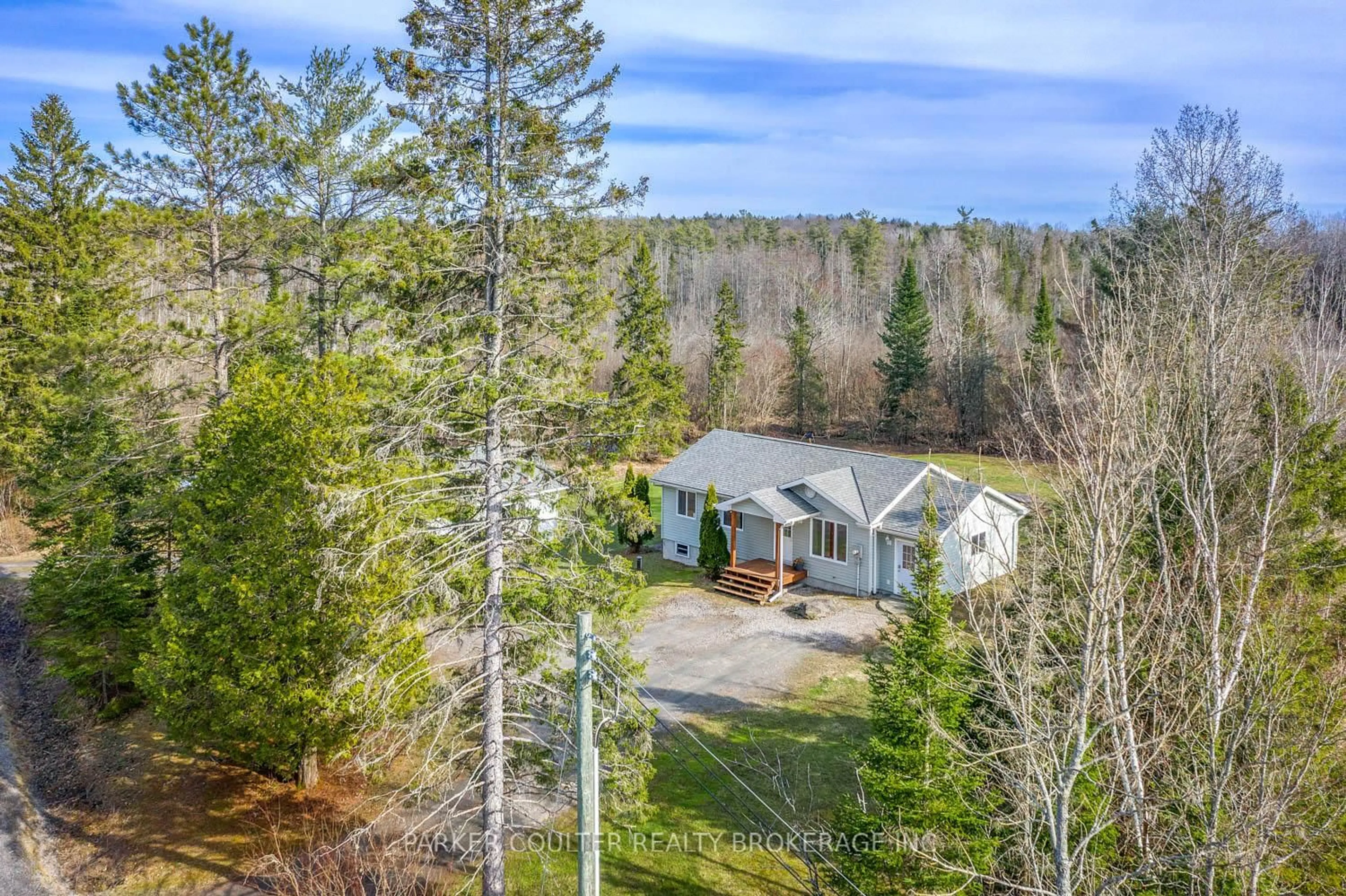A pic from outside/outdoor area/front of a property/back of a property/a pic from drone, forest/trees view for 115 Mccans Rd, Seguin Ontario P0C 1J0