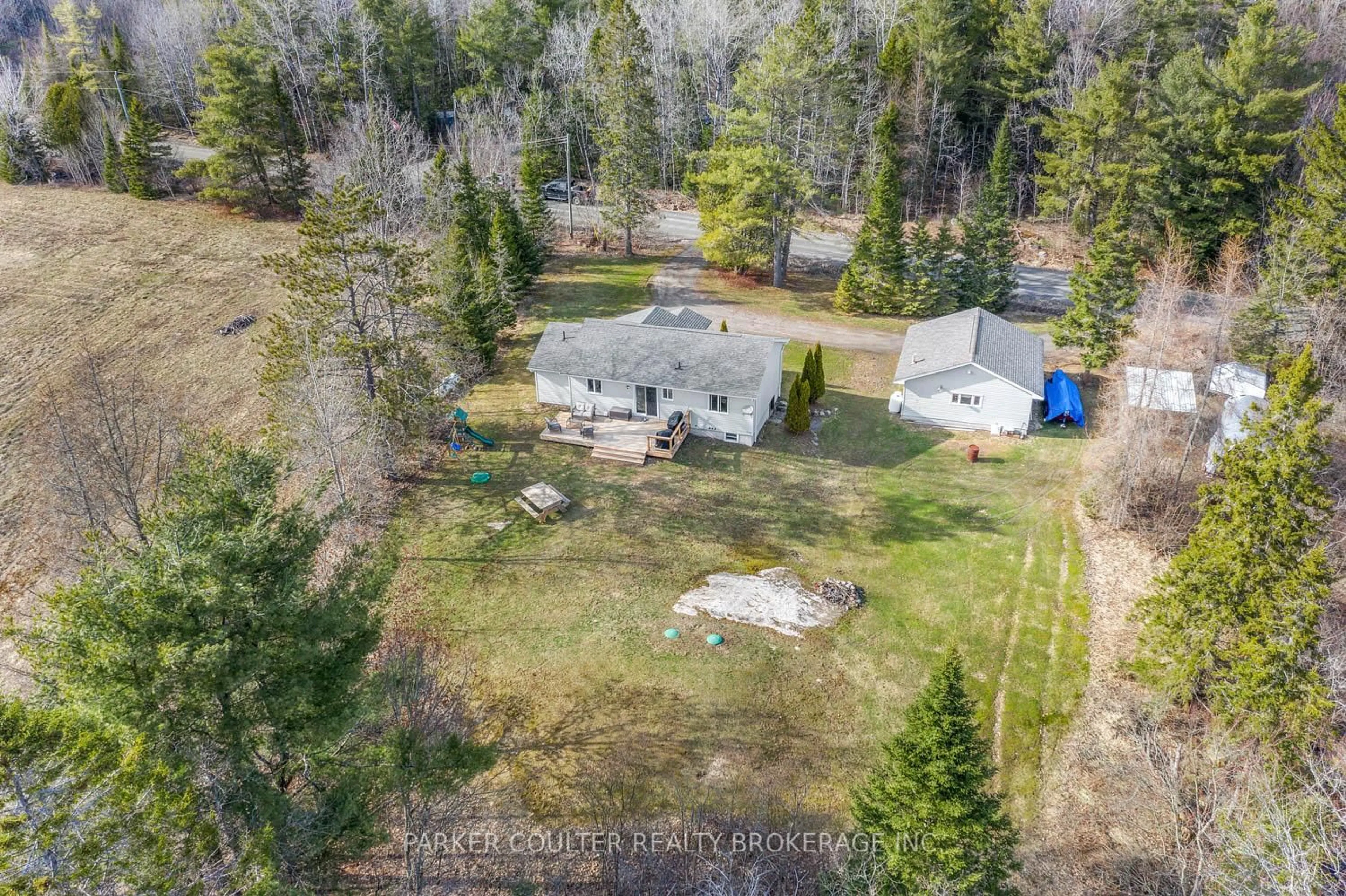 A pic from outside/outdoor area/front of a property/back of a property/a pic from drone, forest/trees view for 115 Mccans Rd, Seguin Ontario P0C 1J0