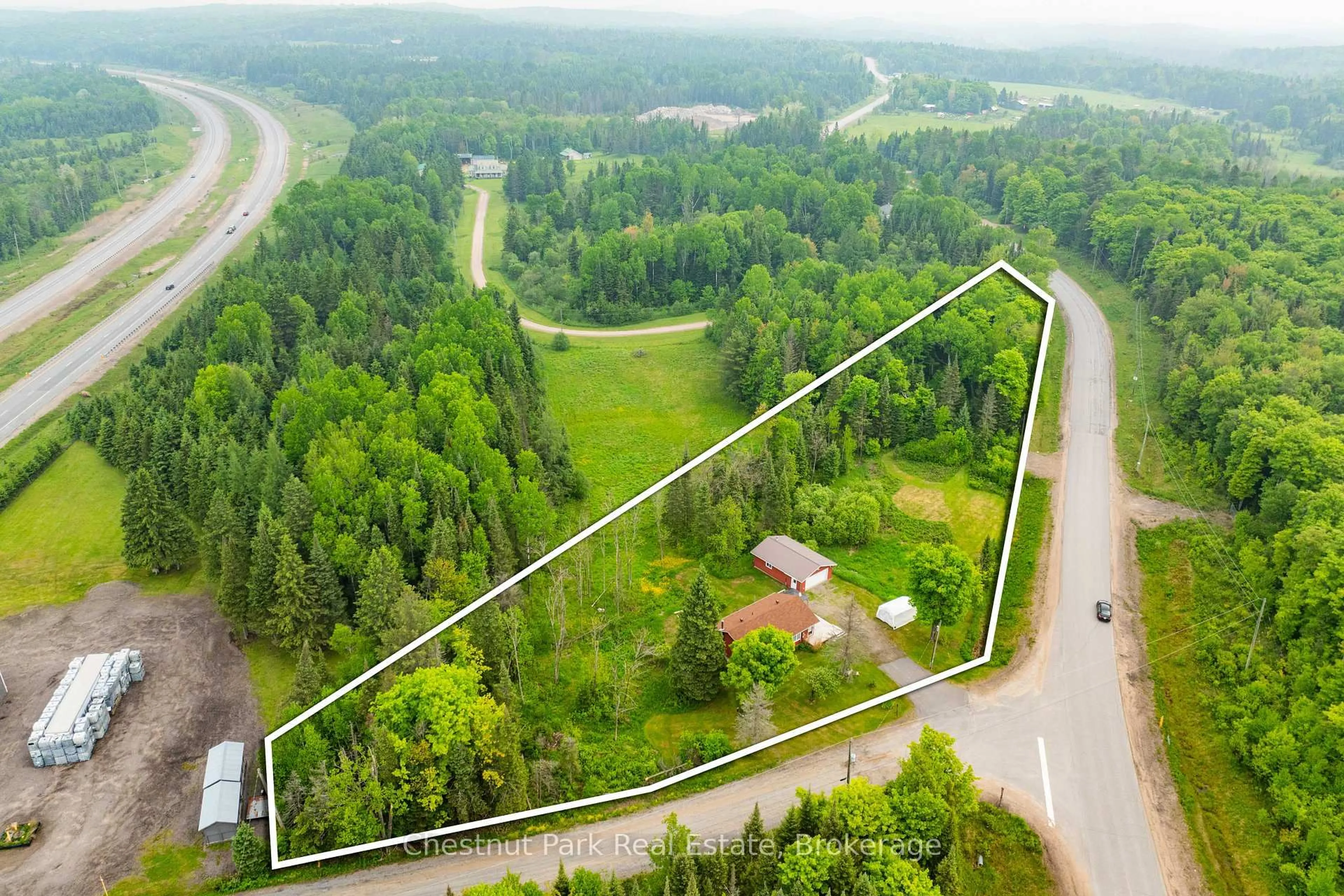 A pic from outside/outdoor area/front of a property/back of a property/a pic from drone, forest/trees view for 1 Christopher Lane, Burk's Falls Ontario P0A 1C0