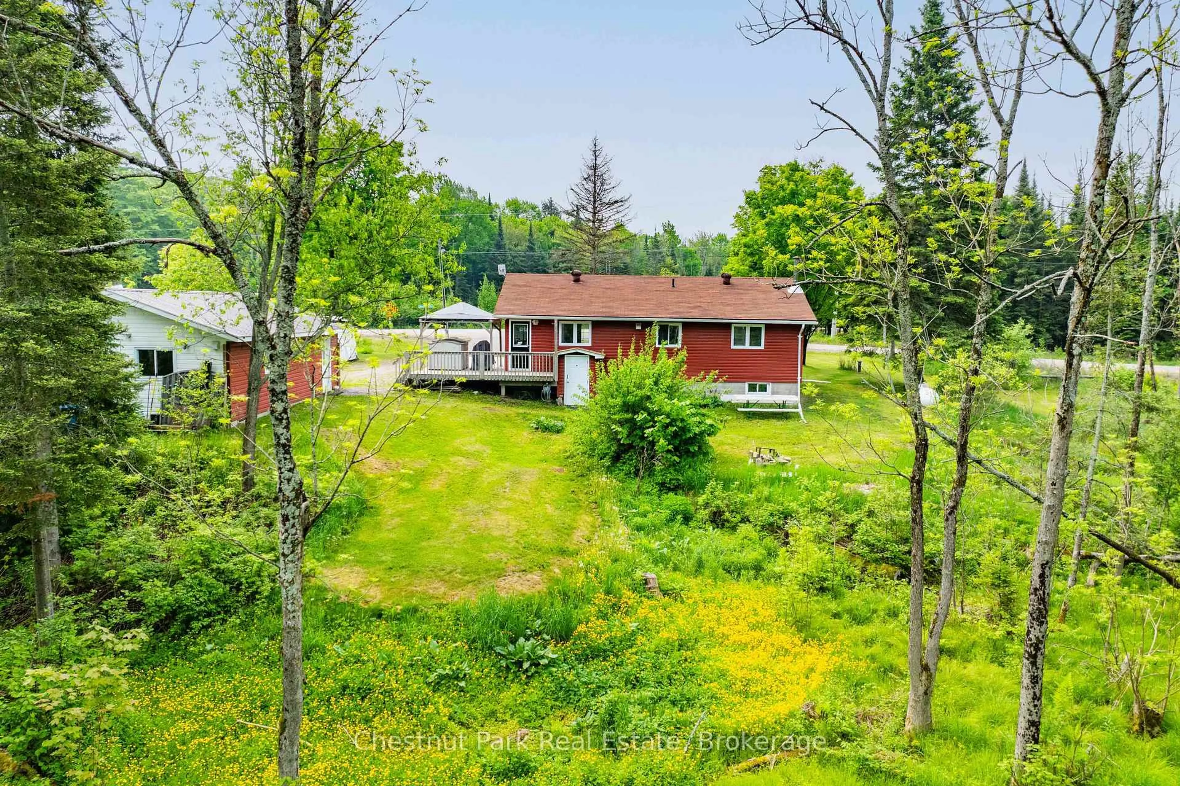 A pic from outside/outdoor area/front of a property/back of a property/a pic from drone, forest/trees view for 1 Christopher Lane, Burk's Falls Ontario P0A 1C0