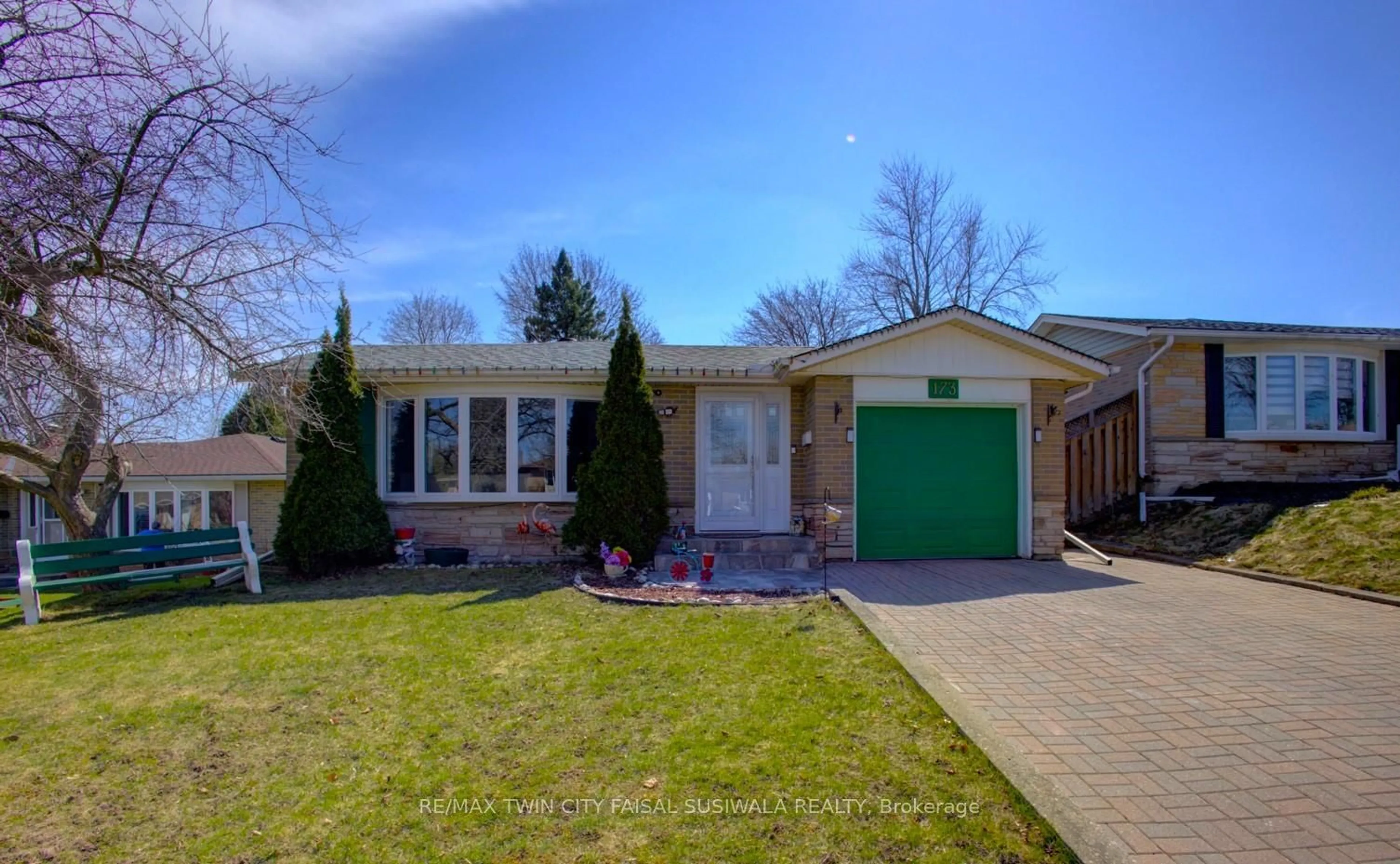 Home with brick exterior material, street for 173 Hazelglen Dr, Kitchener Ontario N2M 2E6