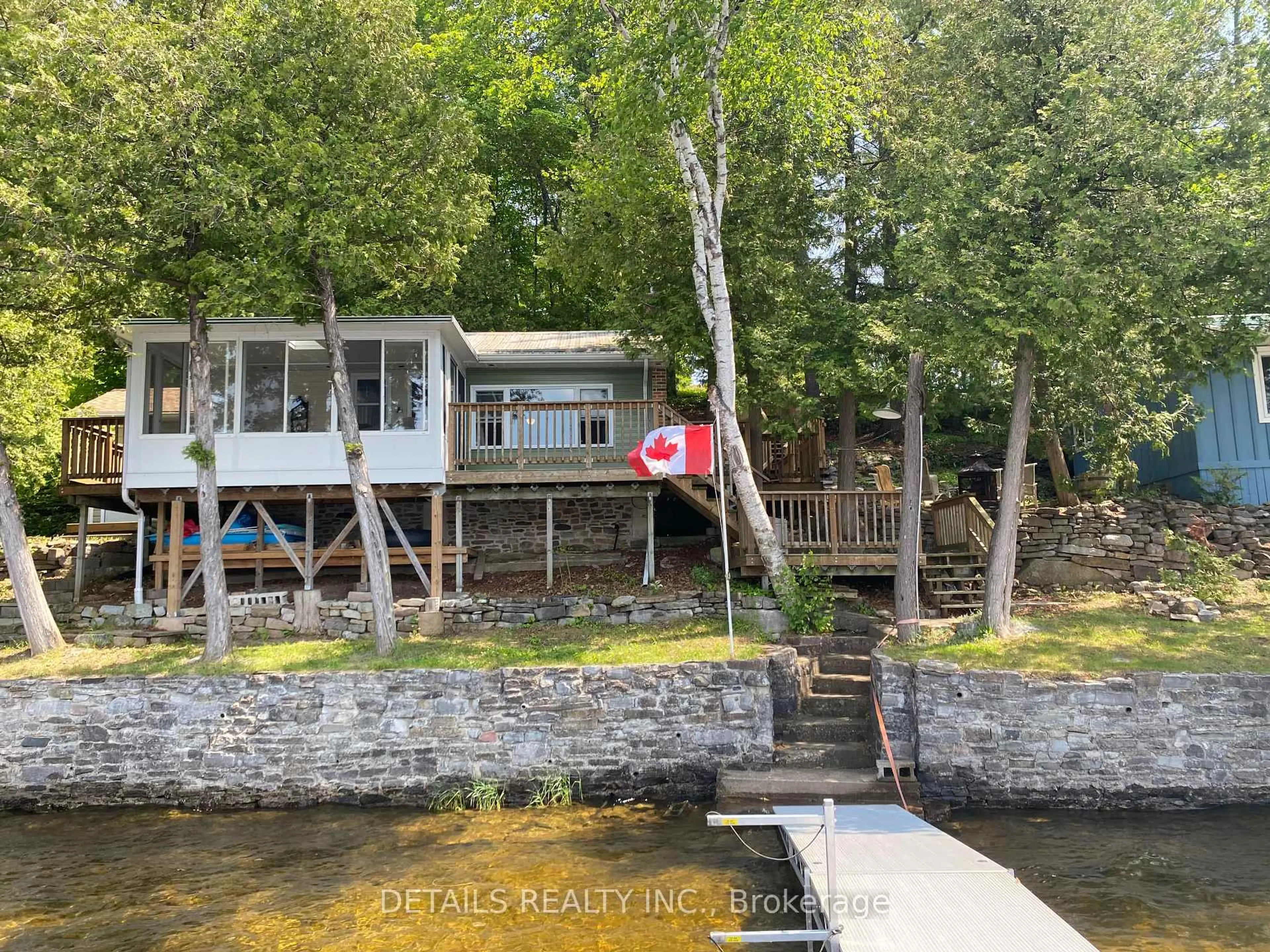 A pic from outside/outdoor area/front of a property/back of a property/a pic from drone, water/lake/river/ocean view for 63 Gordon Crt, Madoc Ontario K0K 2K0