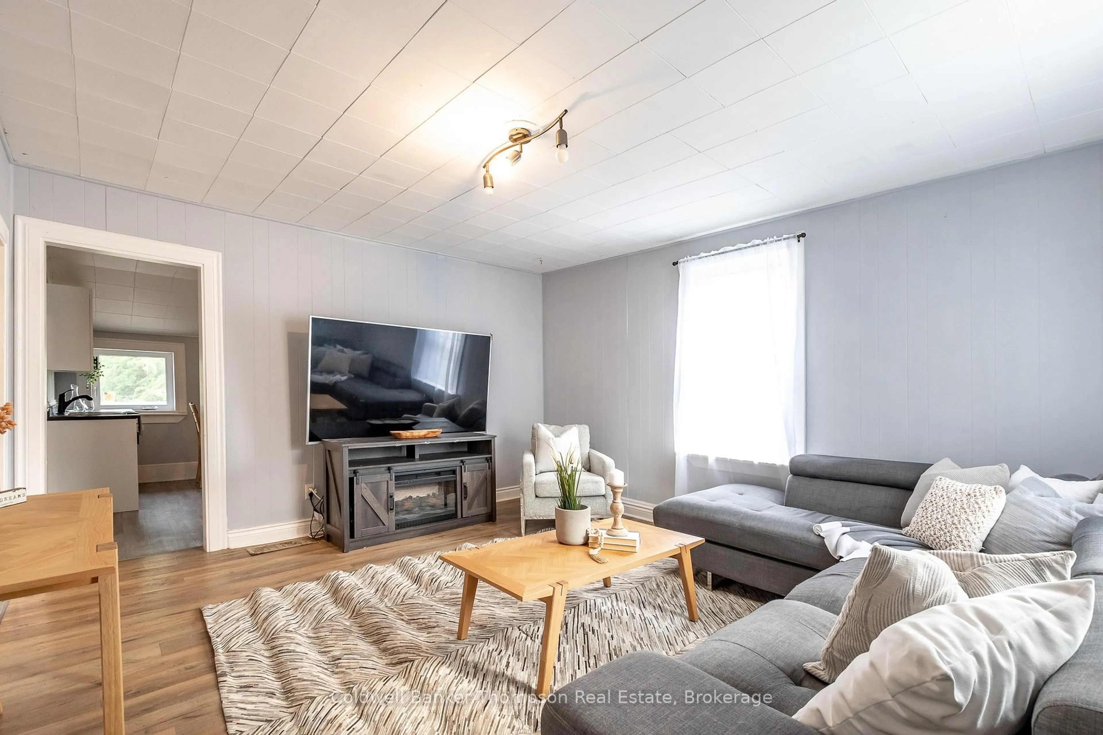 Living room with furniture, wood/laminate floor for 112 Ryerson Cres, Burk's Falls Ontario P0A 1C0