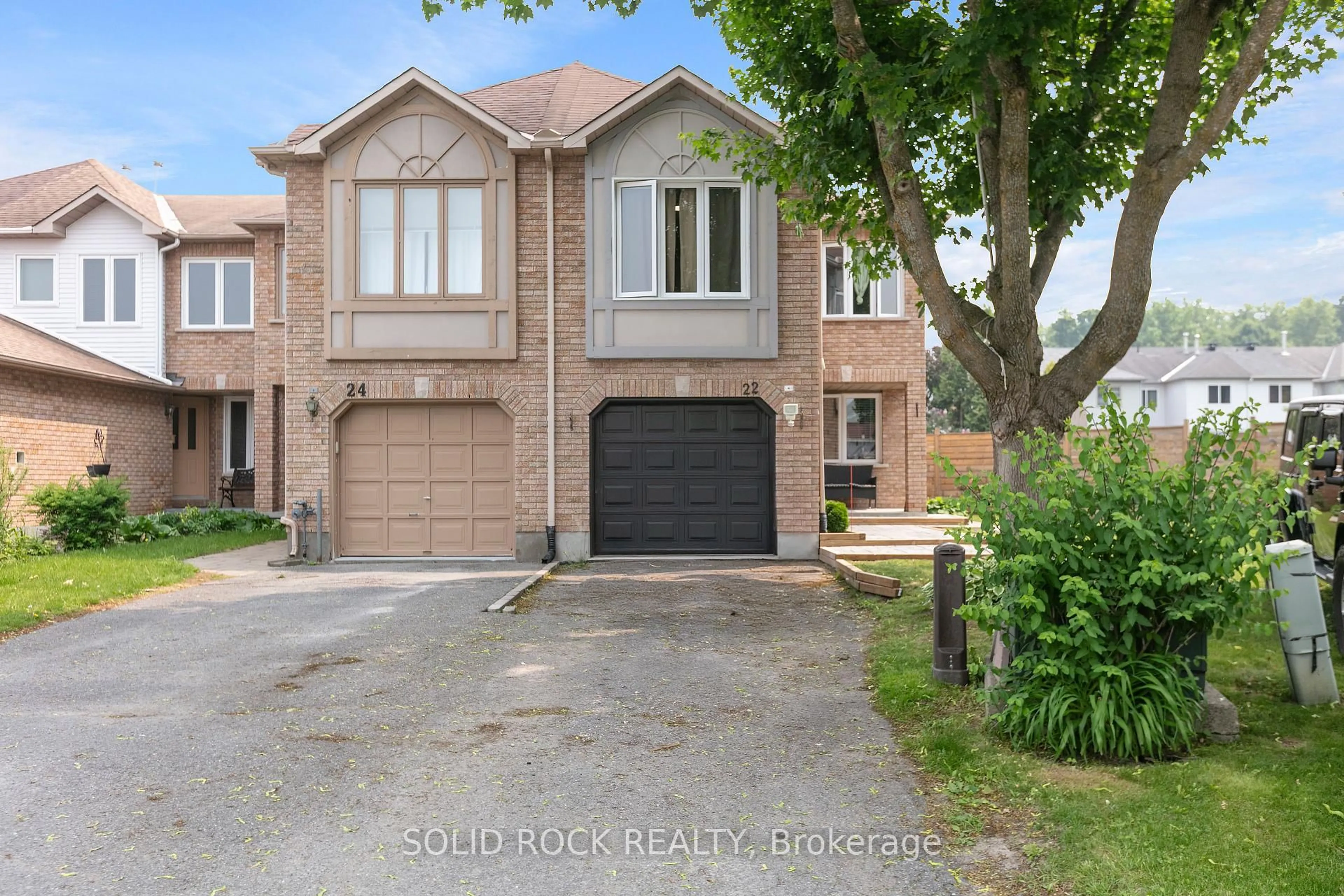 Home with brick exterior material, street for 22 Grenadier Way, Ottawa Ontario K2J 4L3