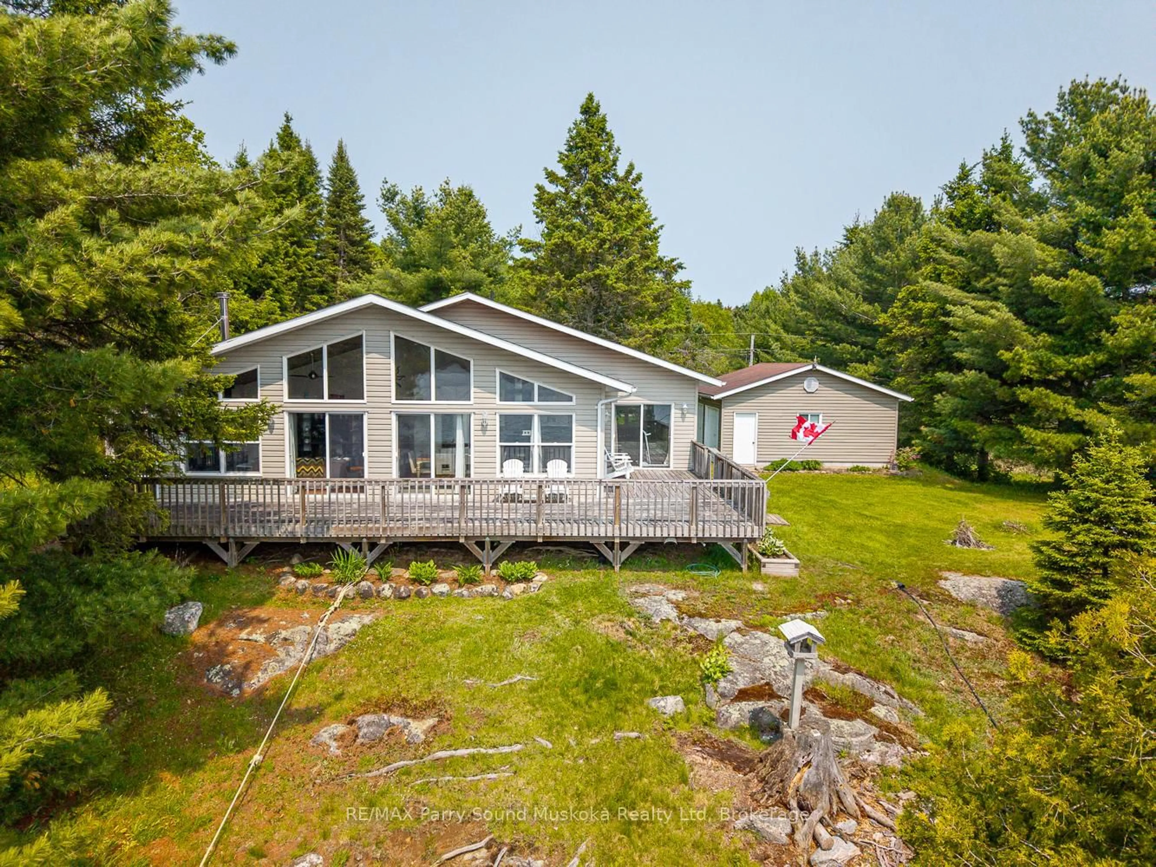 A pic from outside/outdoor area/front of a property/back of a property/a pic from drone, water/lake/river/ocean view for 9 Nickles Cove Rd, Whitestone Ontario P0A 1G0