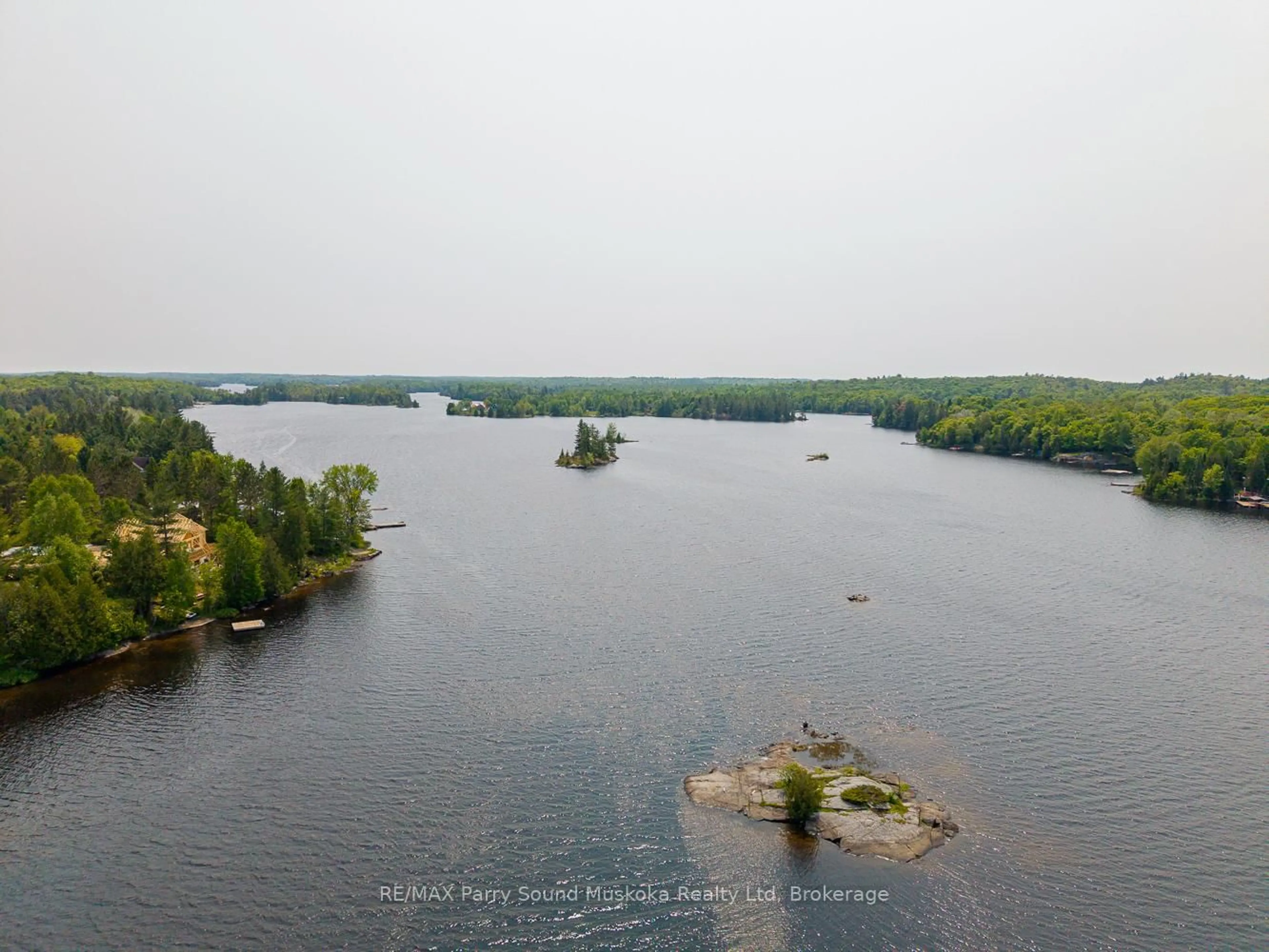 A pic from outside/outdoor area/front of a property/back of a property/a pic from drone, water/lake/river/ocean view for 9 Nickles Cove Rd, Whitestone Ontario P0A 1G0