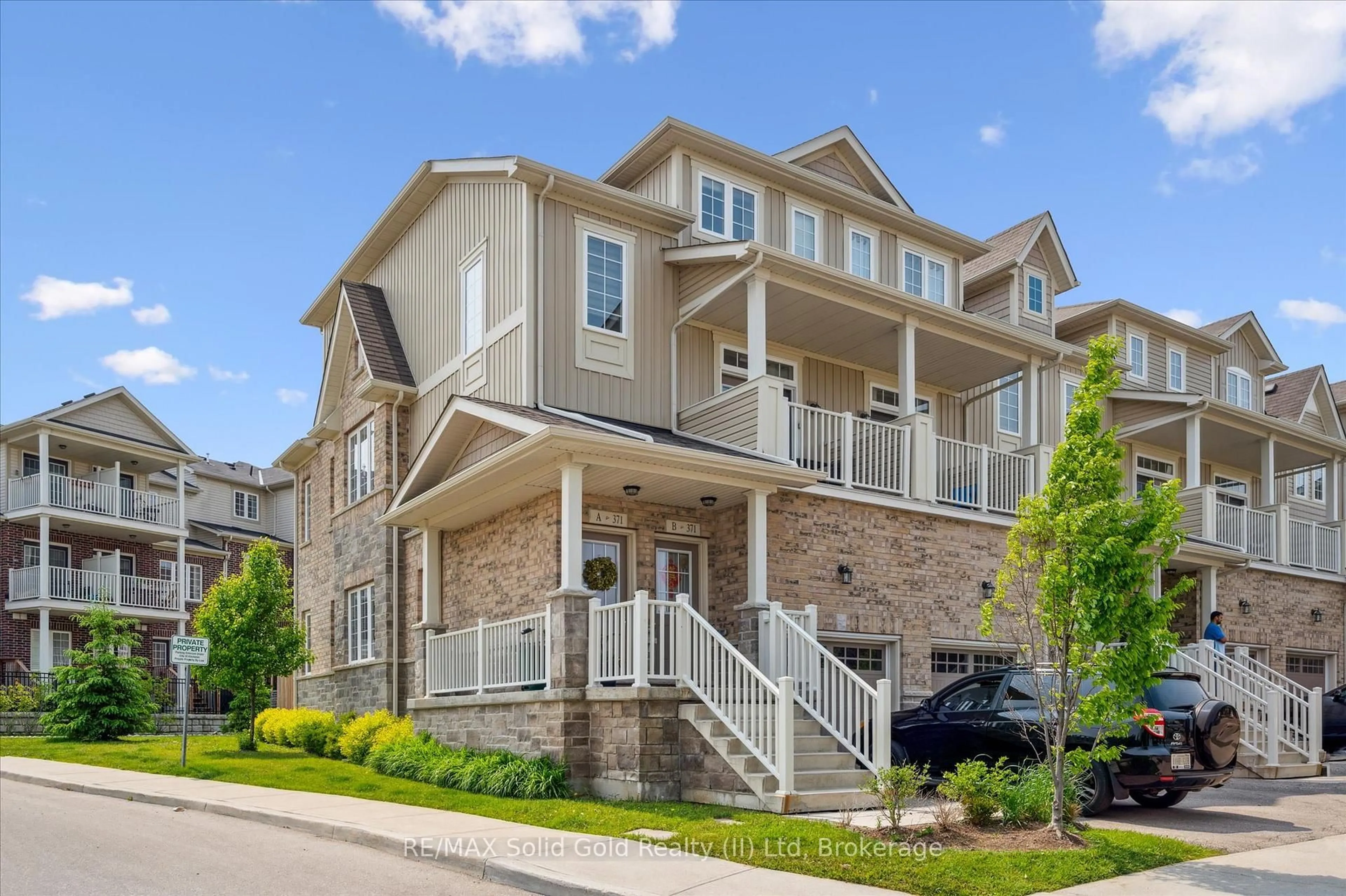 Home with brick exterior material, street for 371A WESTWOOD Dr, Kitchener Ontario N2M 0B5