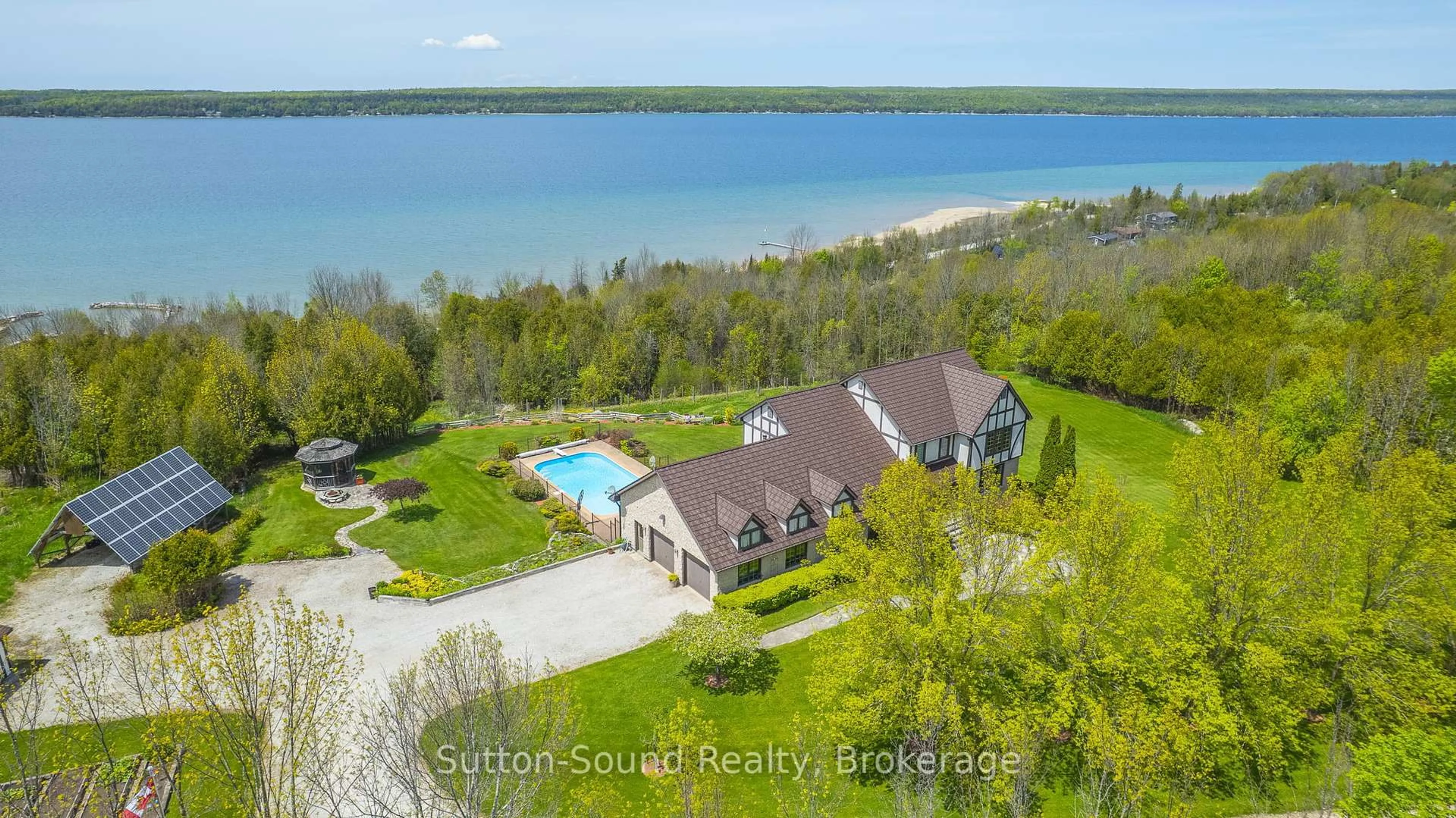 A pic from outside/outdoor area/front of a property/back of a property/a pic from drone, water/lake/river/ocean view for 502121 Grey 1 Rd, Georgian Bluffs Ontario N0H 2T0