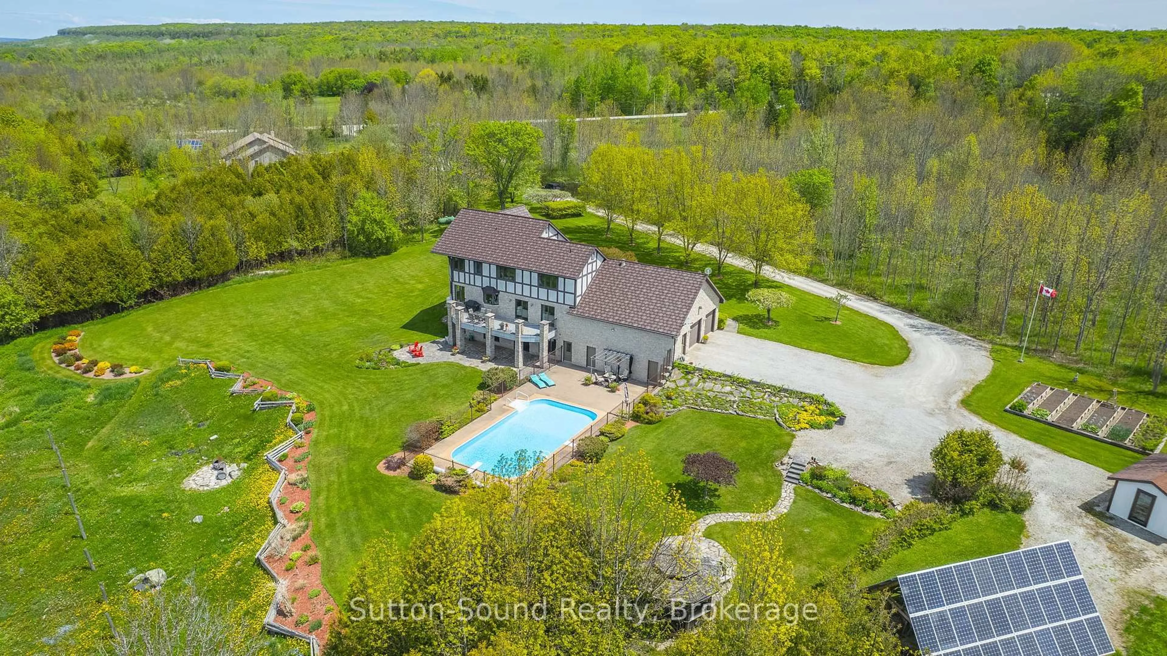 A pic from outside/outdoor area/front of a property/back of a property/a pic from drone, water/lake/river/ocean view for 502121 Grey 1 Rd, Georgian Bluffs Ontario N0H 2T0