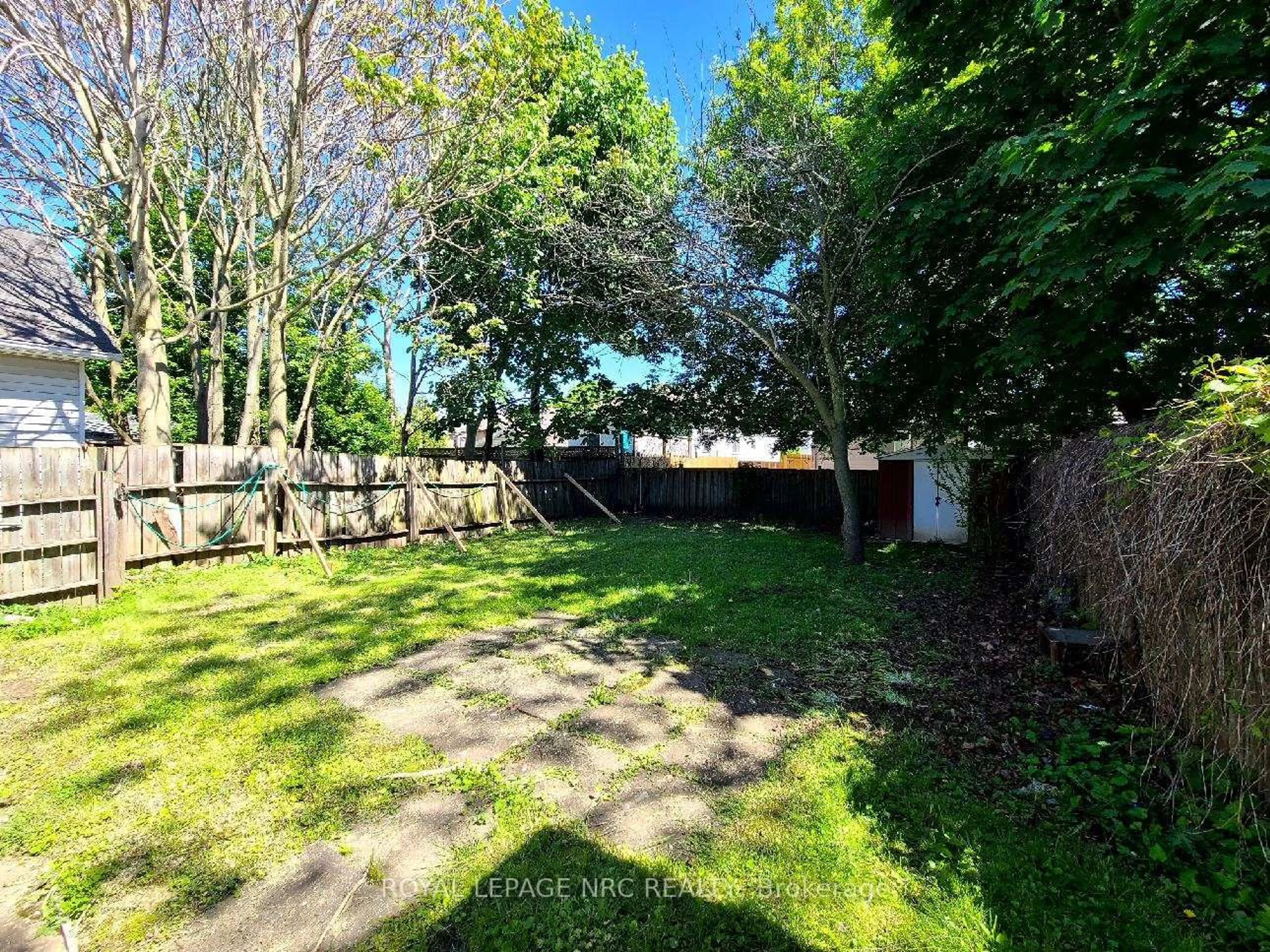 A pic from outside/outdoor area/front of a property/back of a property/a pic from drone, forest/trees view for 106 Carlton St, St. Catharines Ontario L2R 1R3