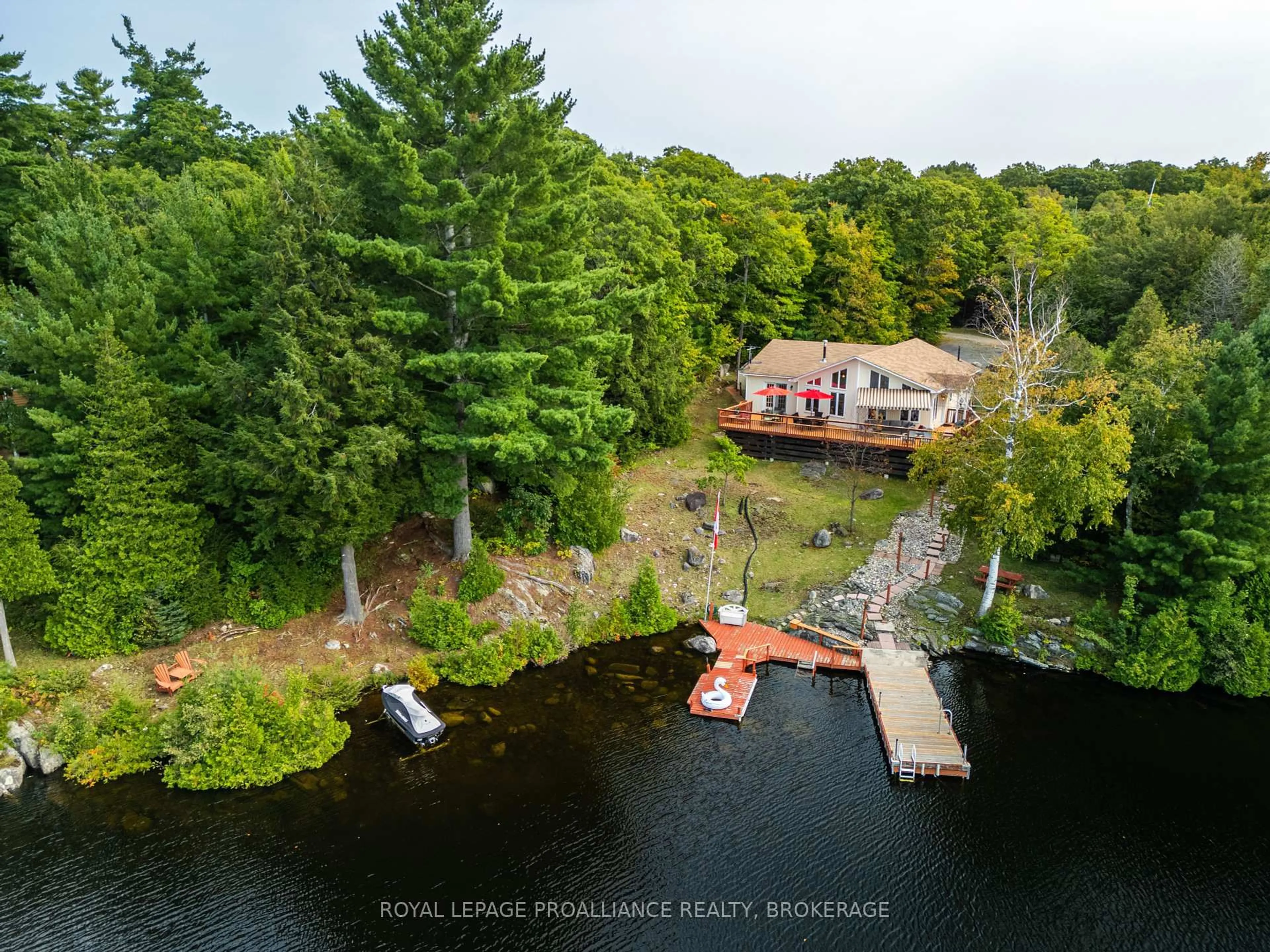A pic from outside/outdoor area/front of a property/back of a property/a pic from drone, water/lake/river/ocean view for 1238 Big Gull Lane, Arden Ontario K0H 1B0