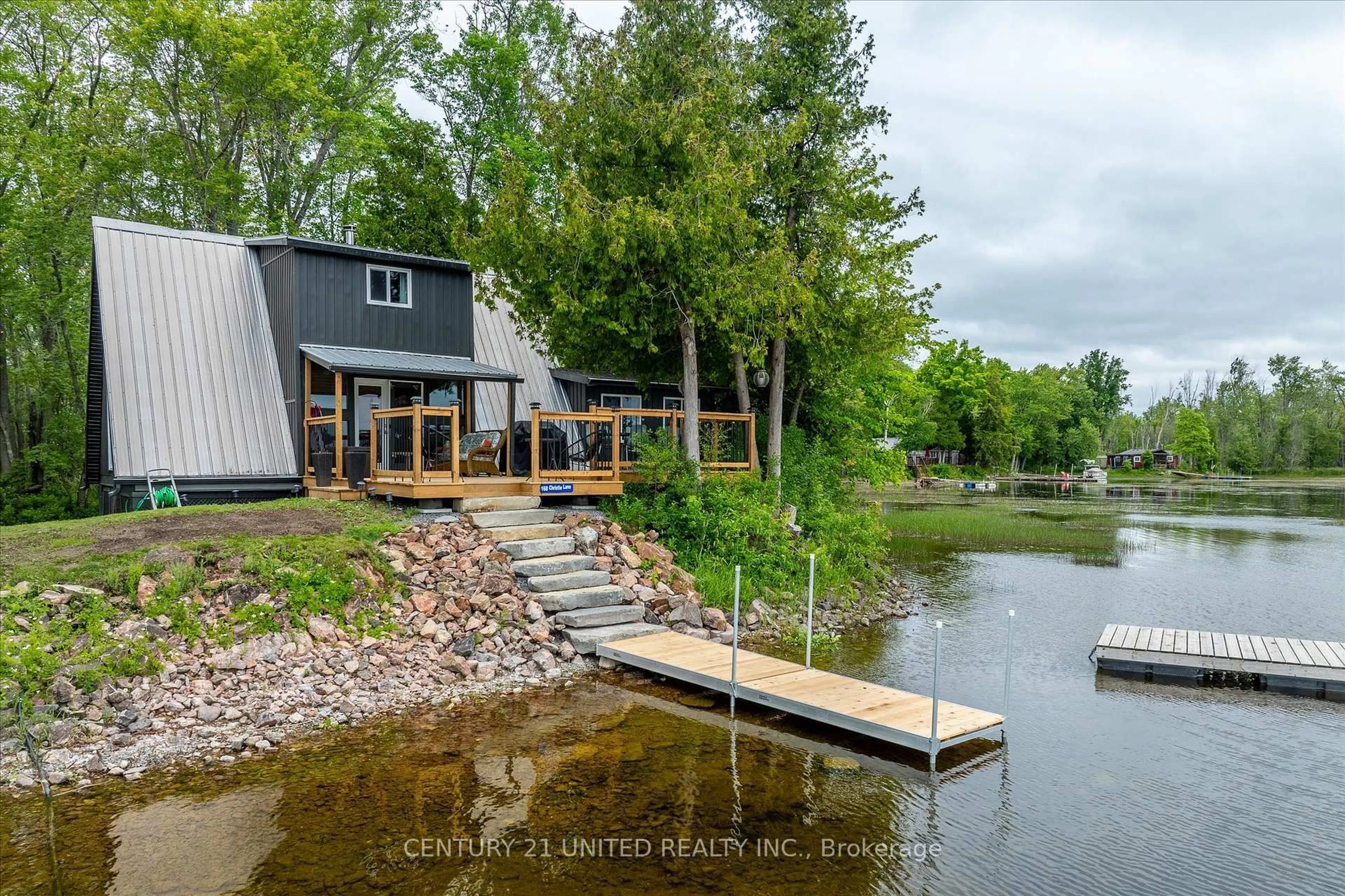 A pic from outside/outdoor area/front of a property/back of a property/a pic from drone, water/lake/river/ocean view for 168 Christie Lane, Madoc Ontario K0K 2K0