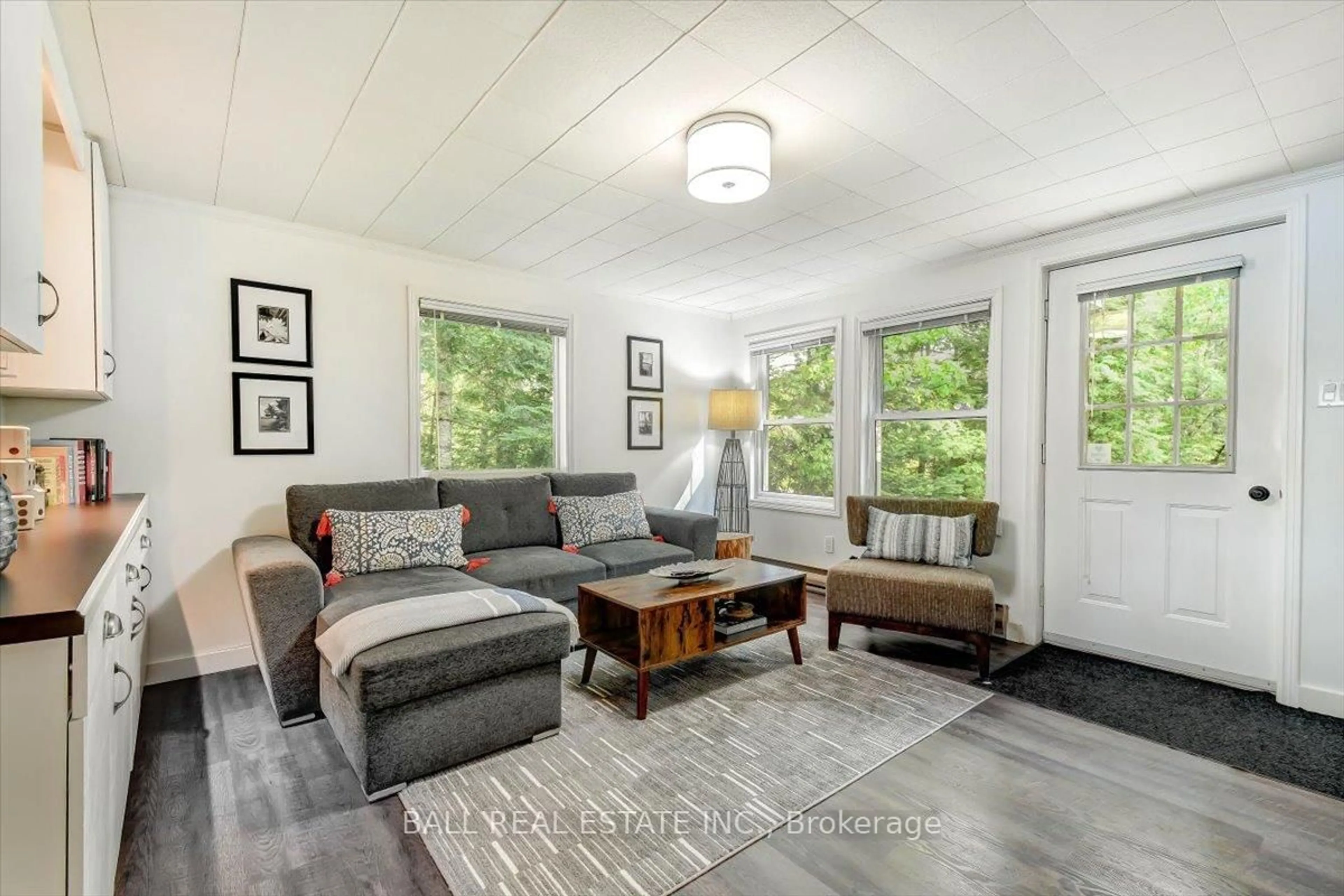 Living room with furniture, wood/laminate floor for 115 Lawrence Lane, Coe Hill Ontario K0L 1P0