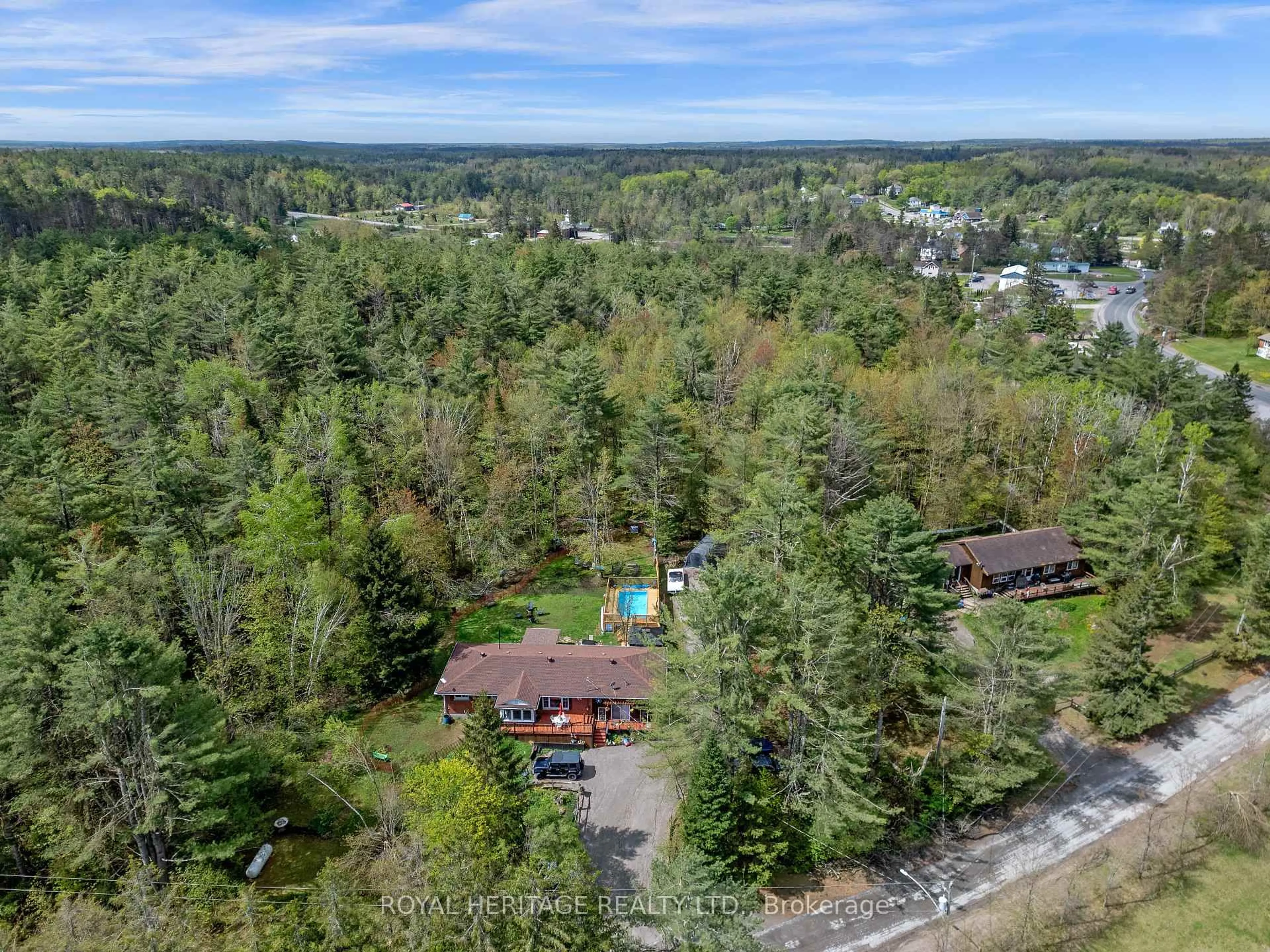 A pic from outside/outdoor area/front of a property/back of a property/a pic from drone, forest/trees view for 26 Reid St, Trent Lakes Ontario K0M 2A0