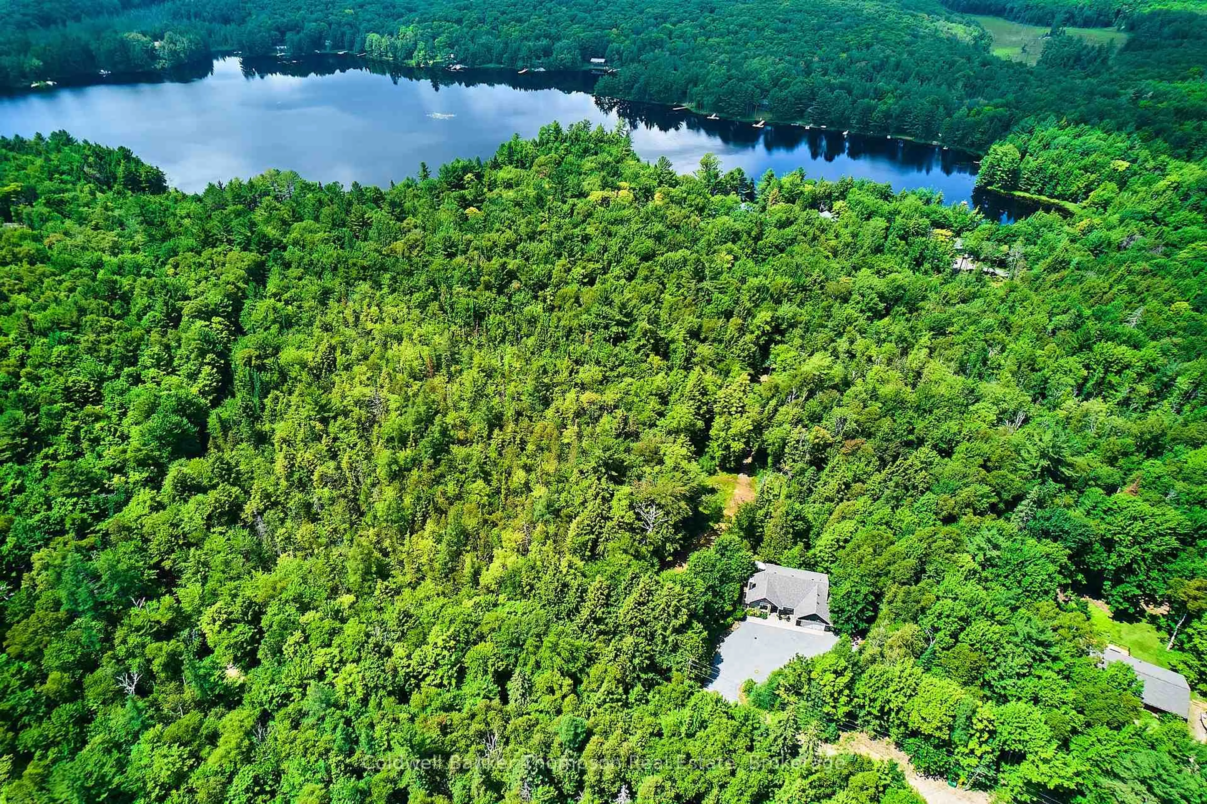 A pic from outside/outdoor area/front of a property/back of a property/a pic from drone, water/lake/river/ocean view for 440 CHUB LAKE Rd, Huntsville Ontario P1H 2J3