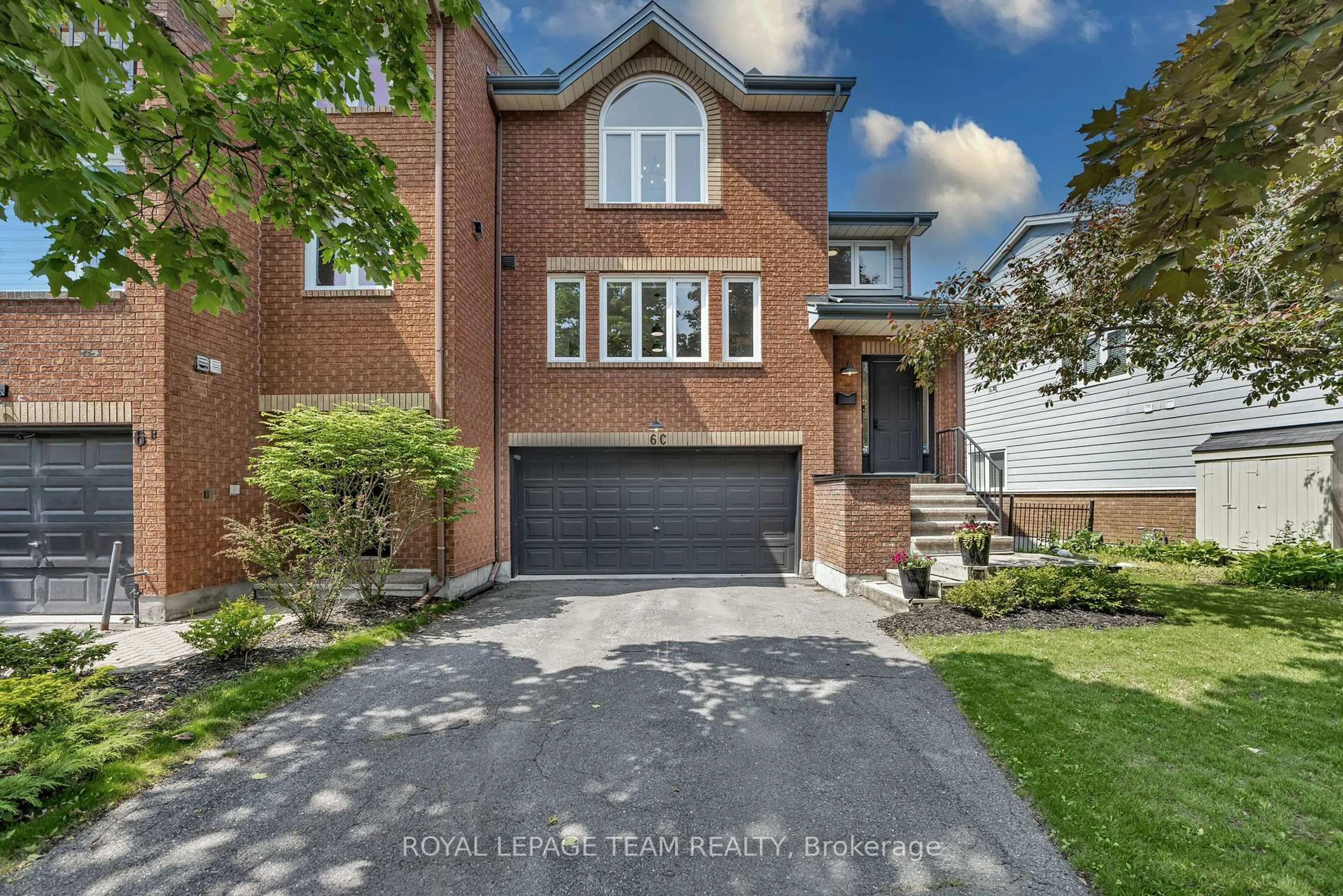 Home with brick exterior material, street for 6C Weslock Way, Kanata Ontario K2K 2K1