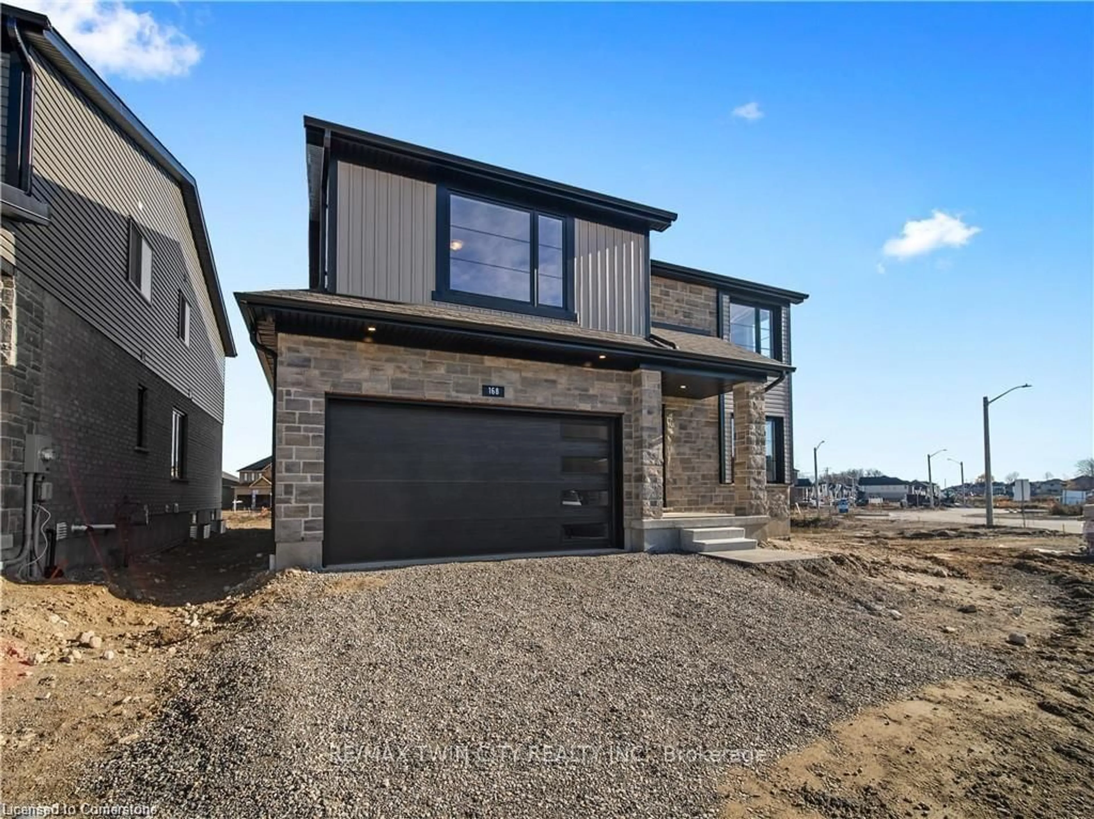 Home with brick exterior material, street for 168 Otterbein Rd, Kitchener Ontario N2B 0A8