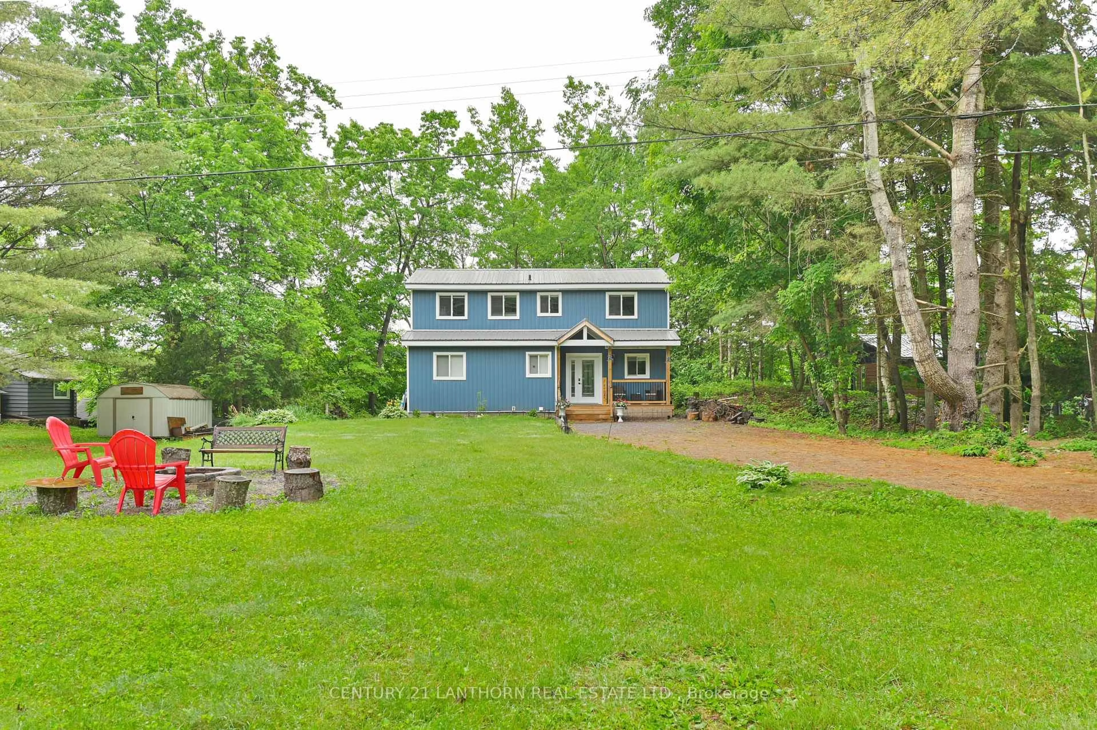 A pic from outside/outdoor area/front of a property/back of a property/a pic from drone, water/lake/river/ocean view for 135 Camp Lane, Tweed Ontario K0K 3J0