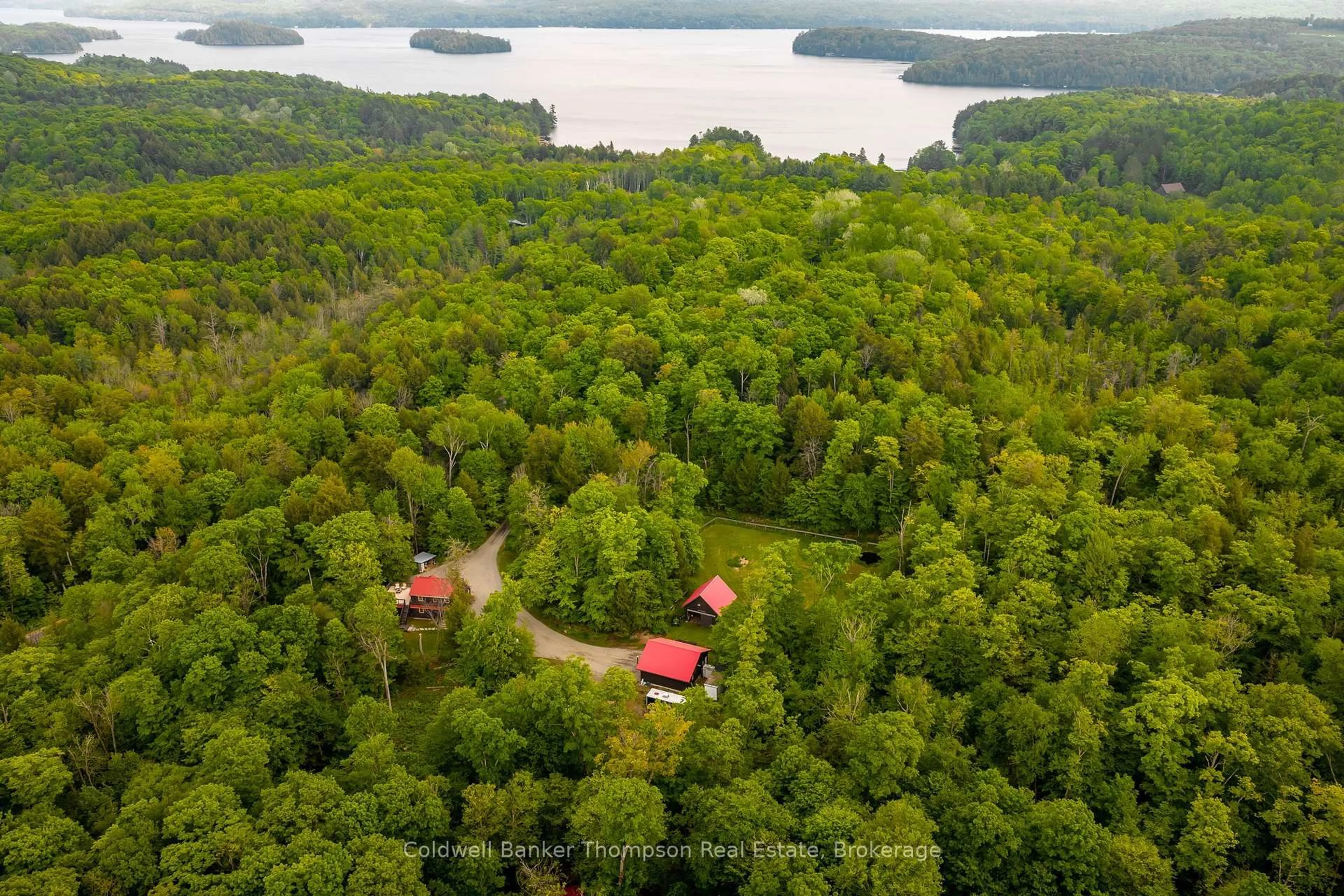 A pic from outside/outdoor area/front of a property/back of a property/a pic from drone, water/lake/river/ocean view for 1626 Port Cunnington Rd, Lake of Bays Ontario P0A 1H0