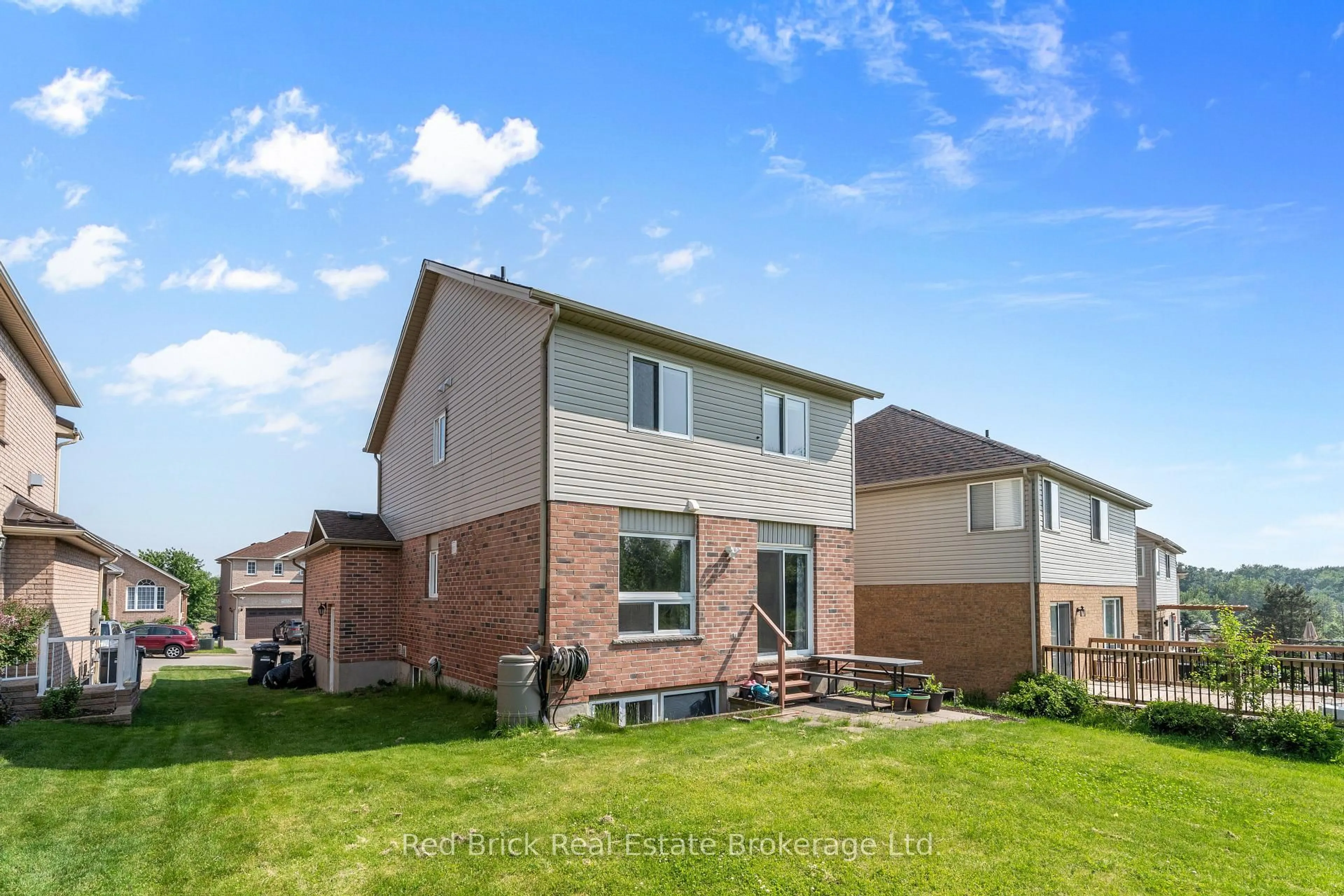 Home with brick exterior material, street for 105 Flaherty Dr, Guelph Ontario N1K 1Y7