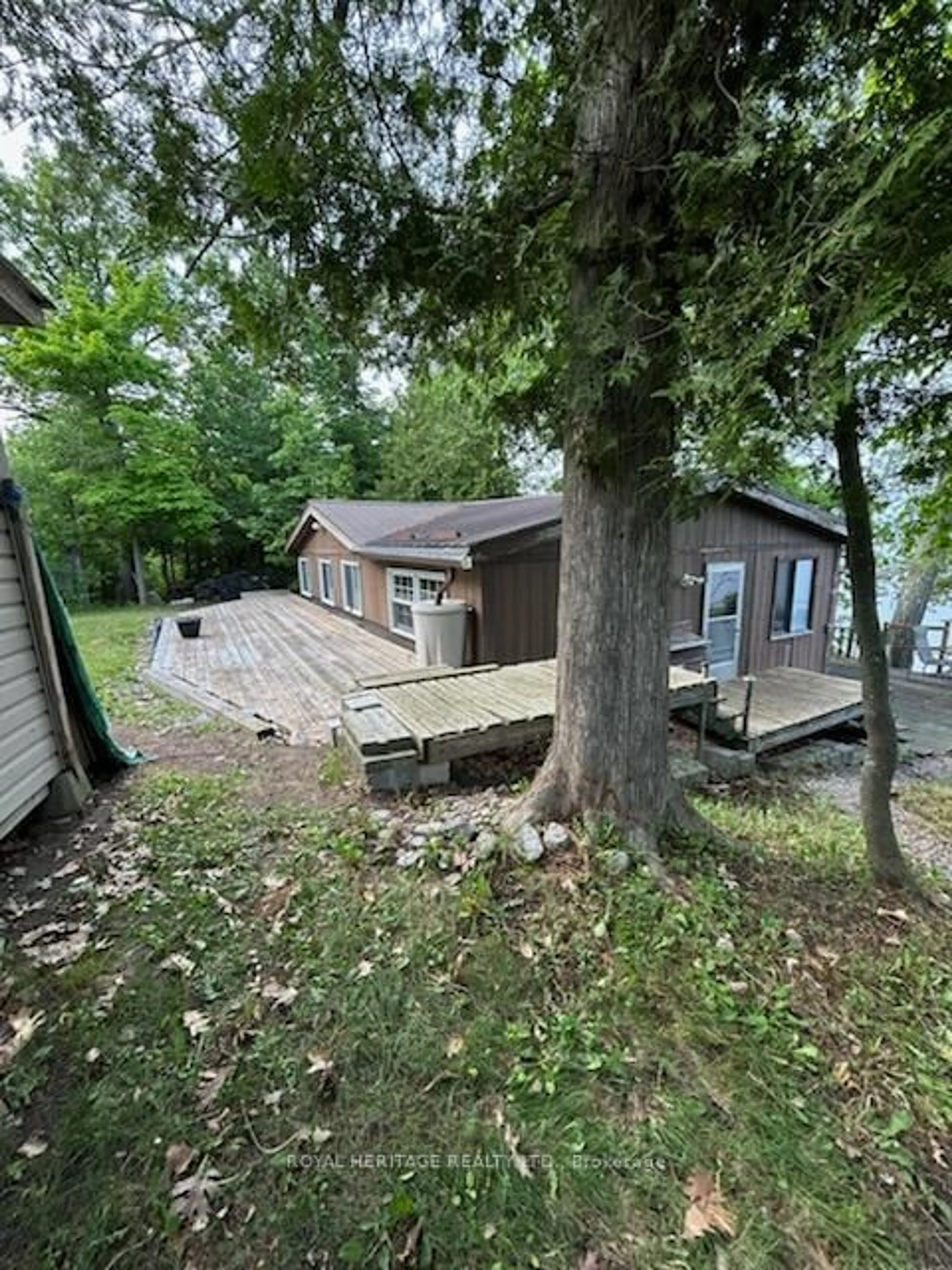 A pic from outside/outdoor area/front of a property/back of a property/a pic from drone, water/lake/river/ocean view for 1474 Grenadier Island, Selwyn Ontario K0L 2H0