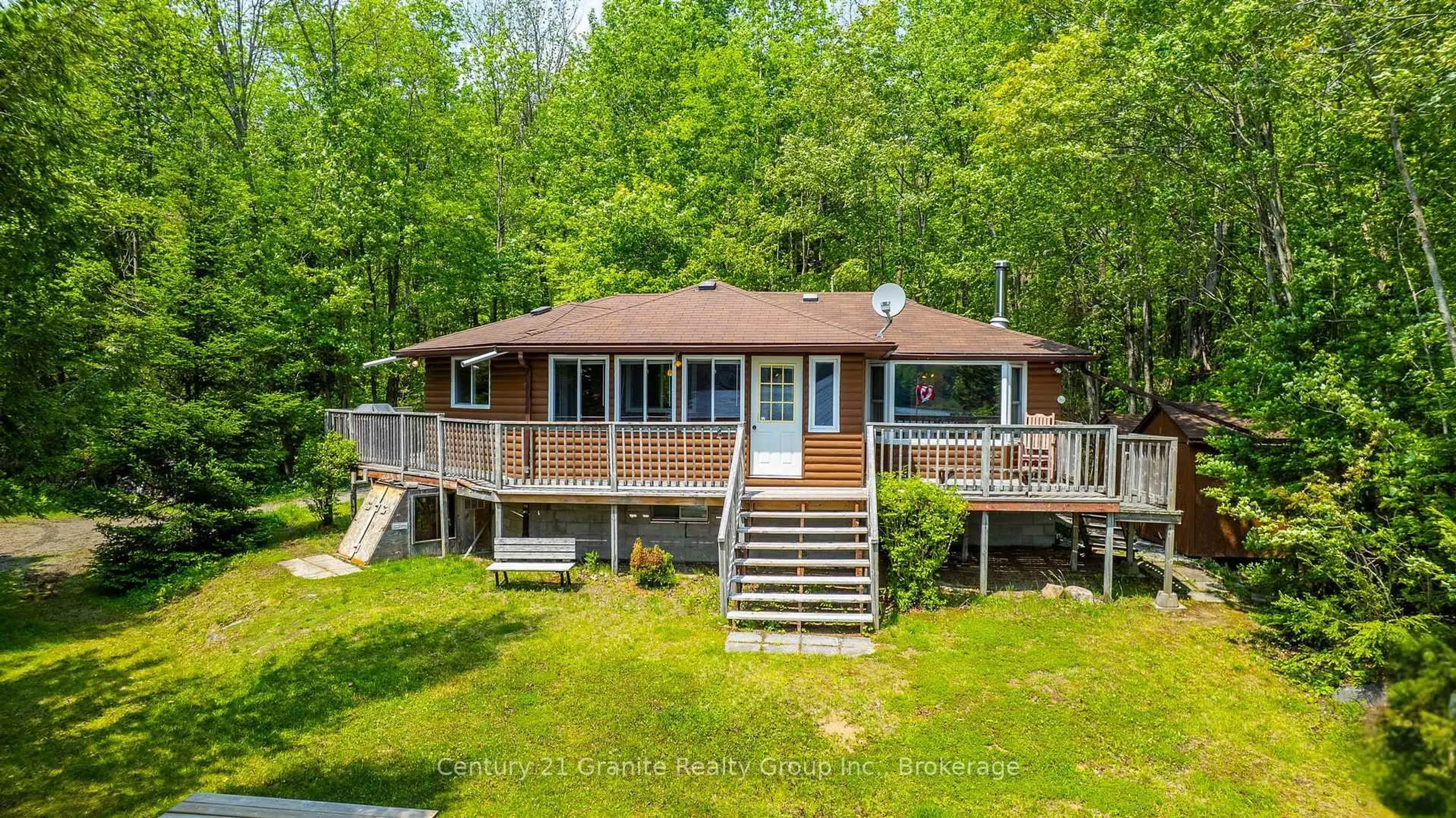 A pic from outside/outdoor area/front of a property/back of a property/a pic from drone, water/lake/river/ocean view for 1147 Comfort Dr, Highlands East Ontario K0M 1R0
