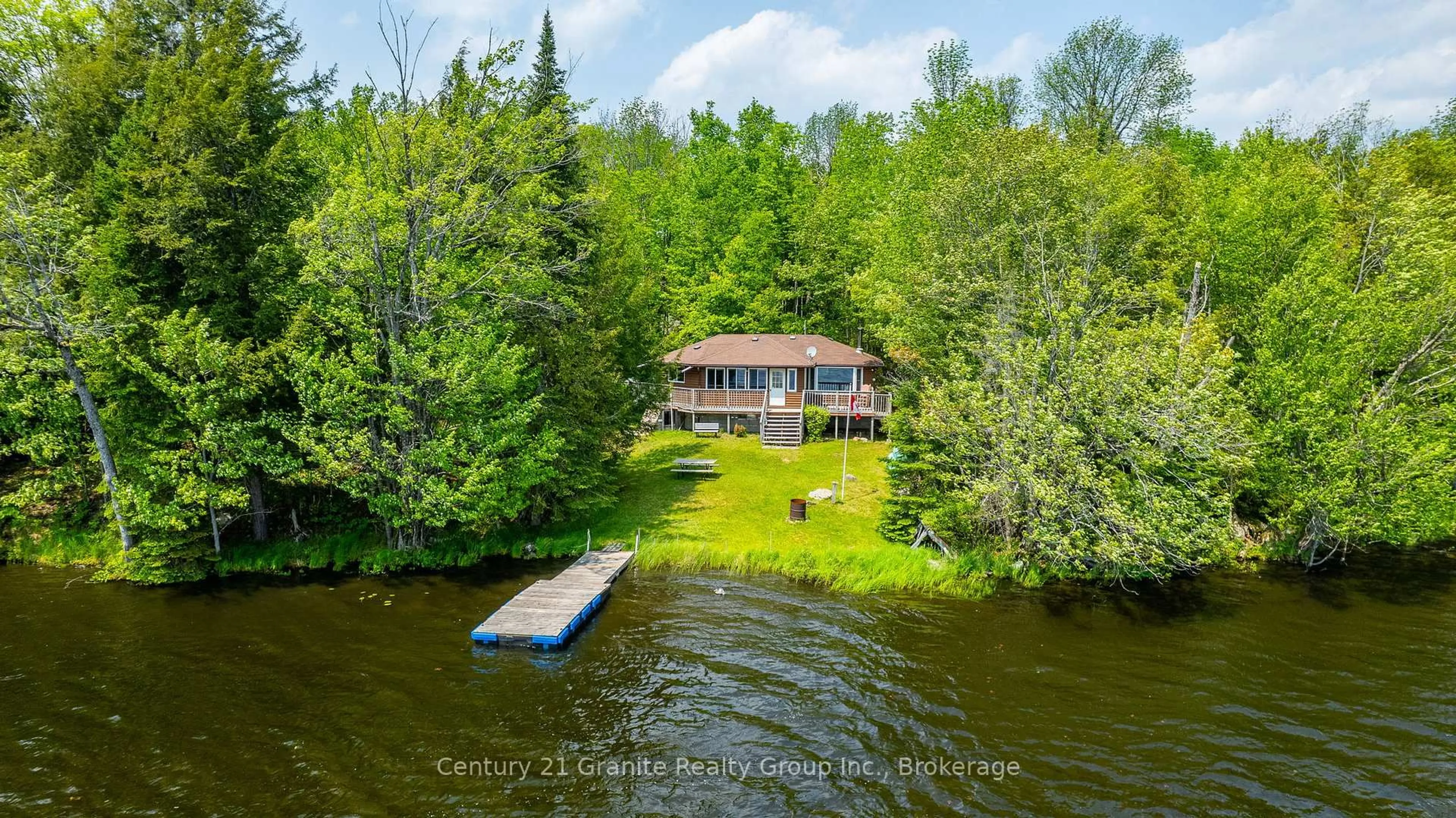 A pic from outside/outdoor area/front of a property/back of a property/a pic from drone, water/lake/river/ocean view for 1147 Comfort Dr, Highlands East Ontario K0M 1R0