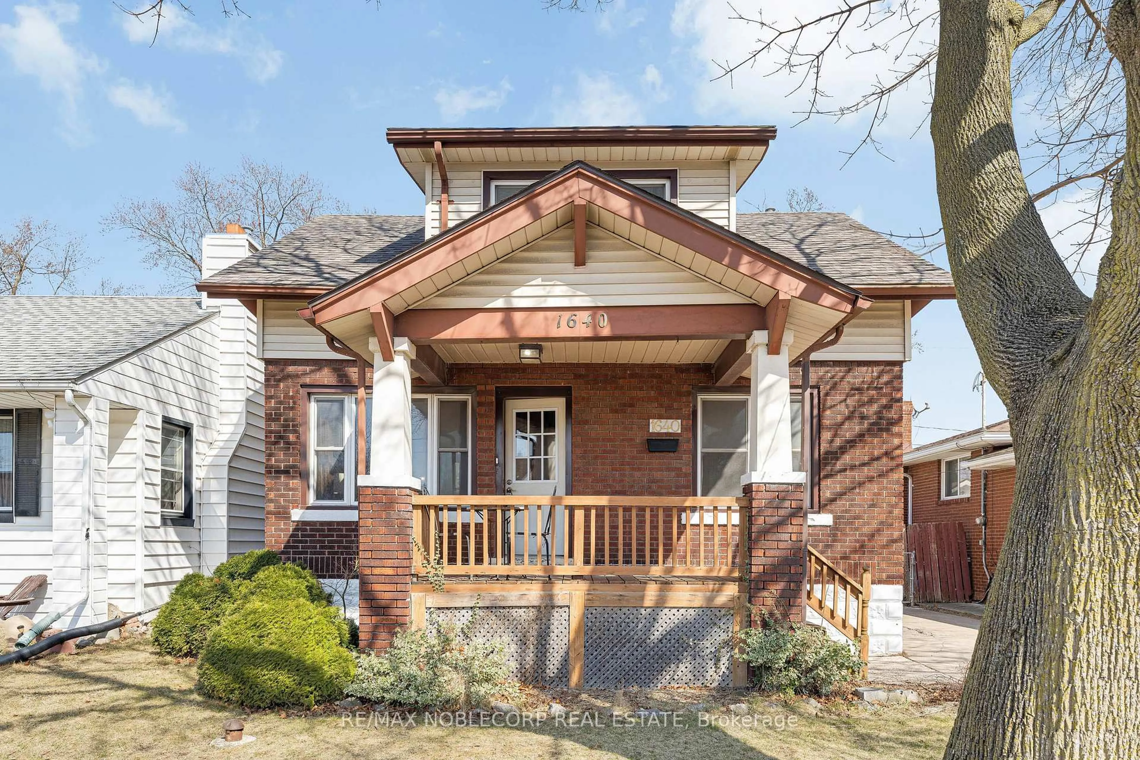 Home with brick exterior material, street for 1640 Pillette Rd, Windsor Ontario N8Y 3C5