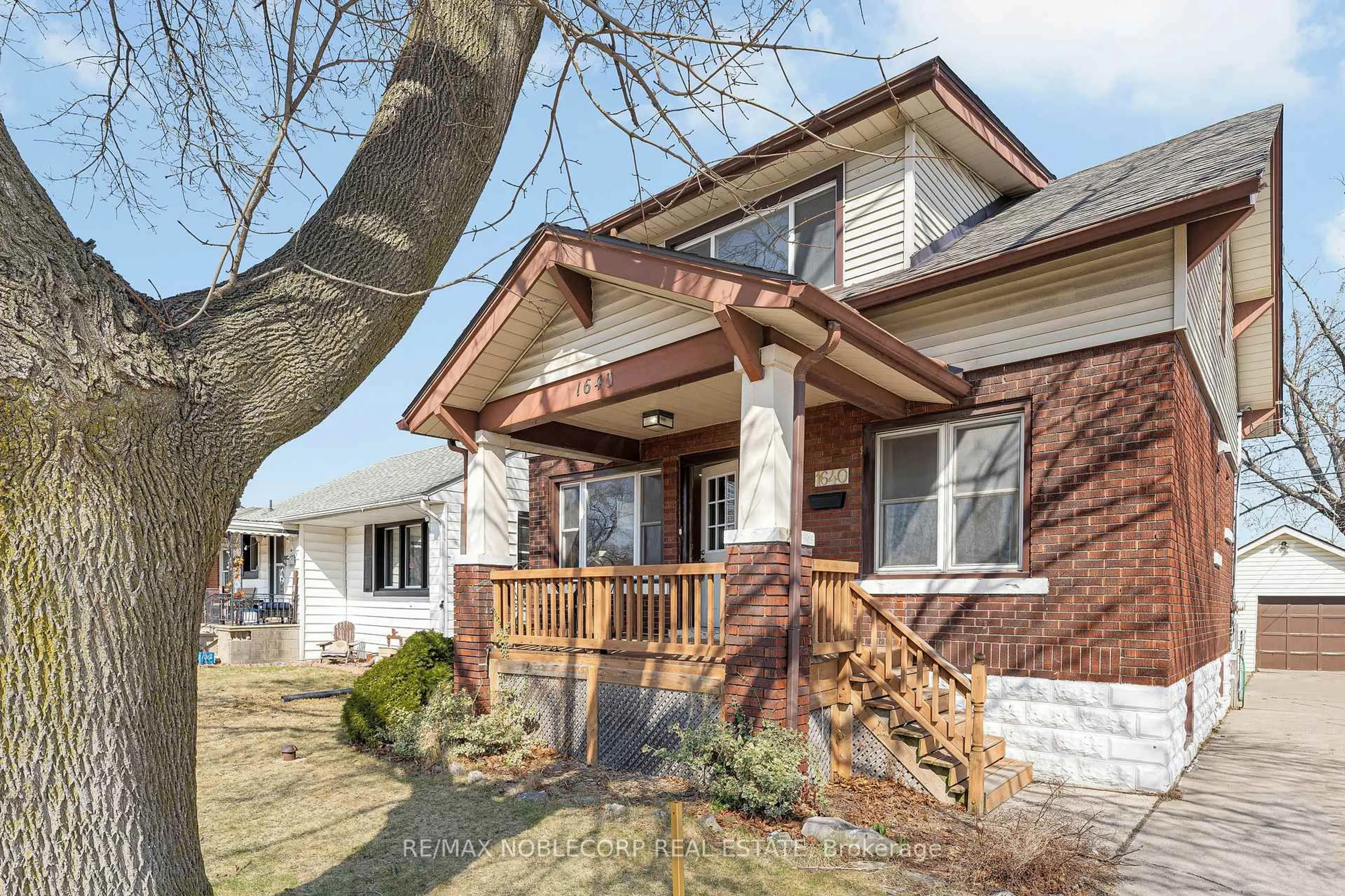 Home with brick exterior material, street for 1640 Pillette Rd, Windsor Ontario N8Y 3C5