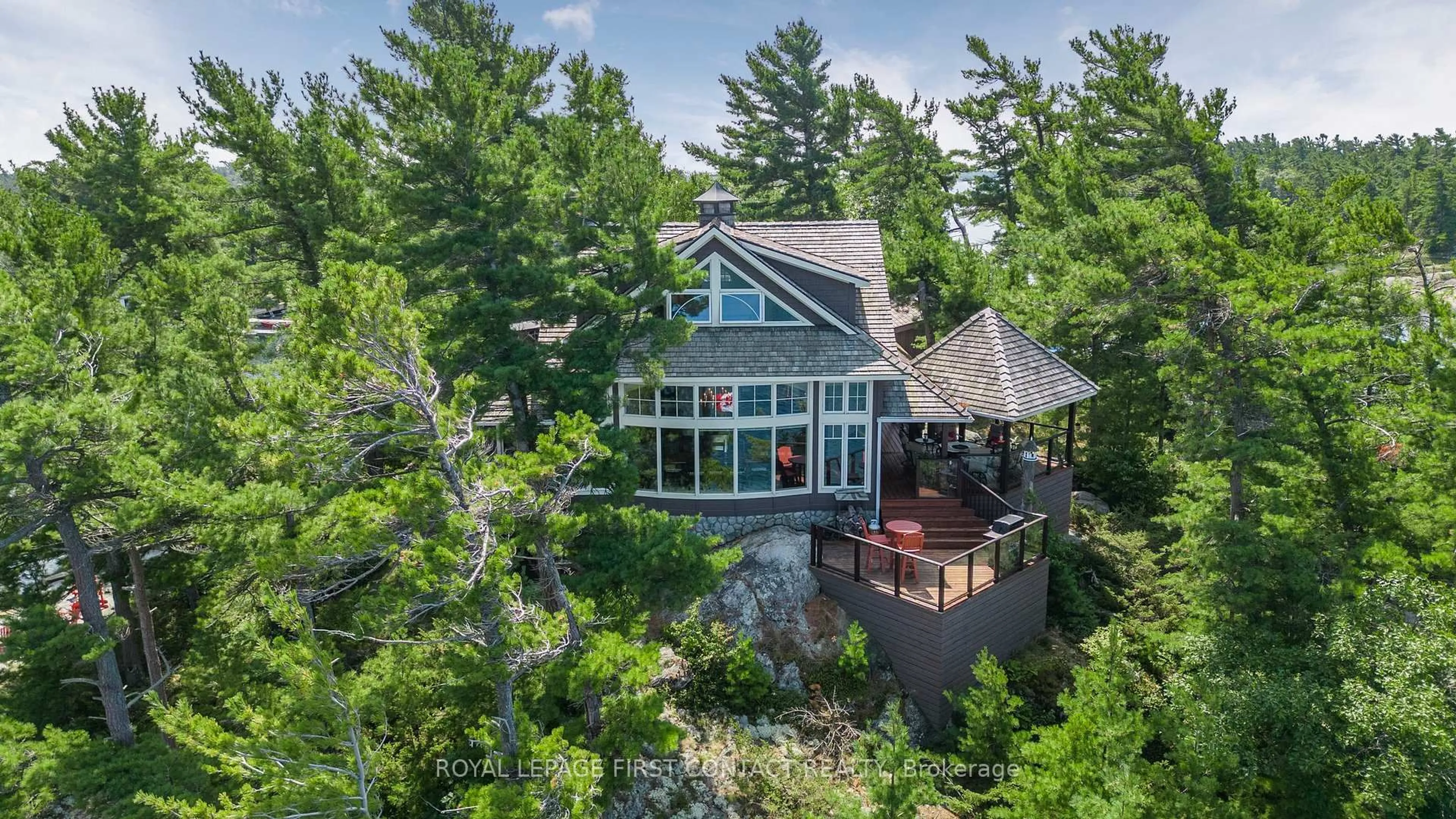 A pic from outside/outdoor area/front of a property/back of a property/a pic from drone, water/lake/river/ocean view for B-209 Lumsden Island, The Archipelago Ontario P2A 2N9