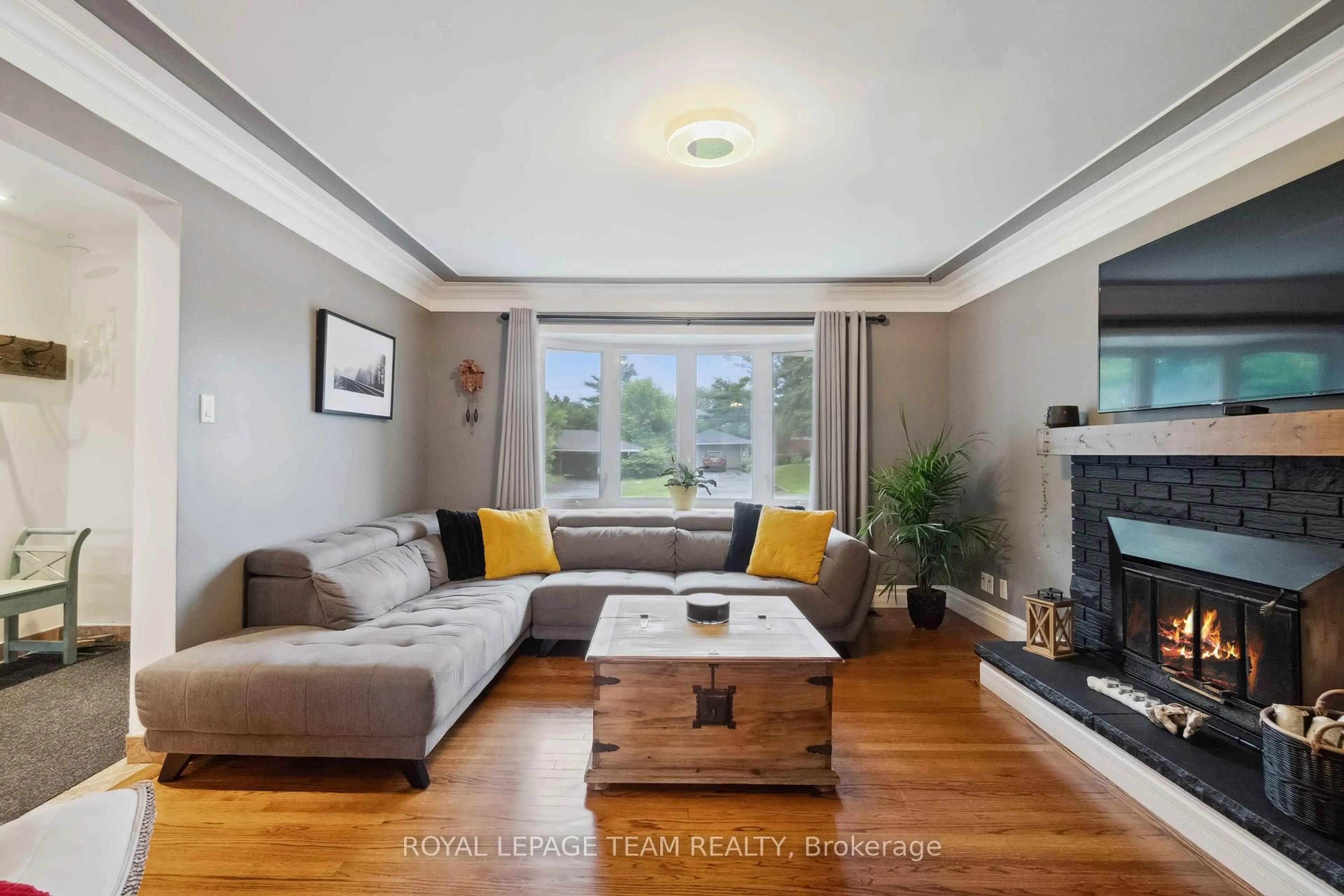 Living room with furniture, wood/laminate floor for 80 David Dr, Ottawa Ontario K2G 2N5