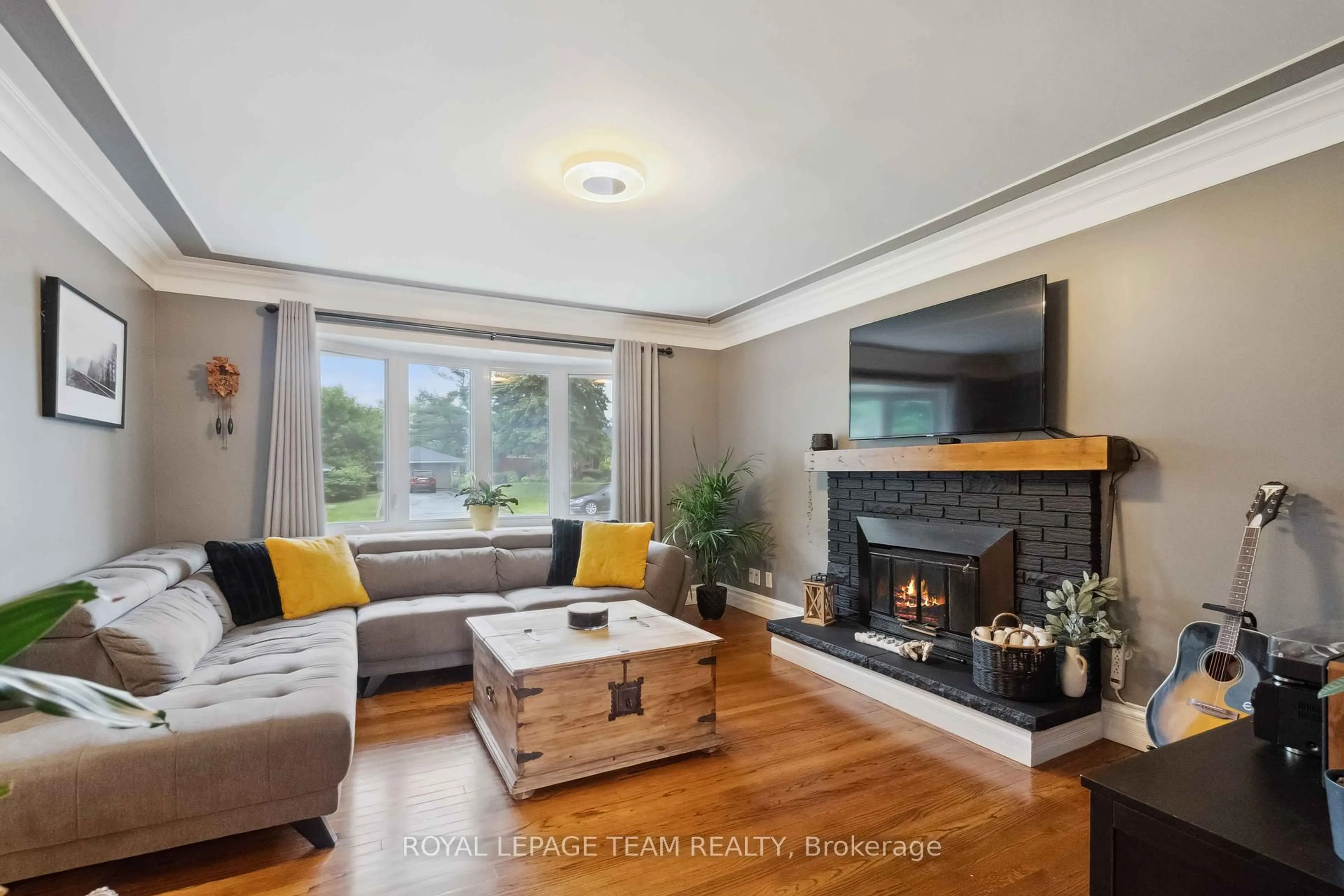 Living room with furniture, wood/laminate floor for 80 David Dr, Ottawa Ontario K2G 2N5