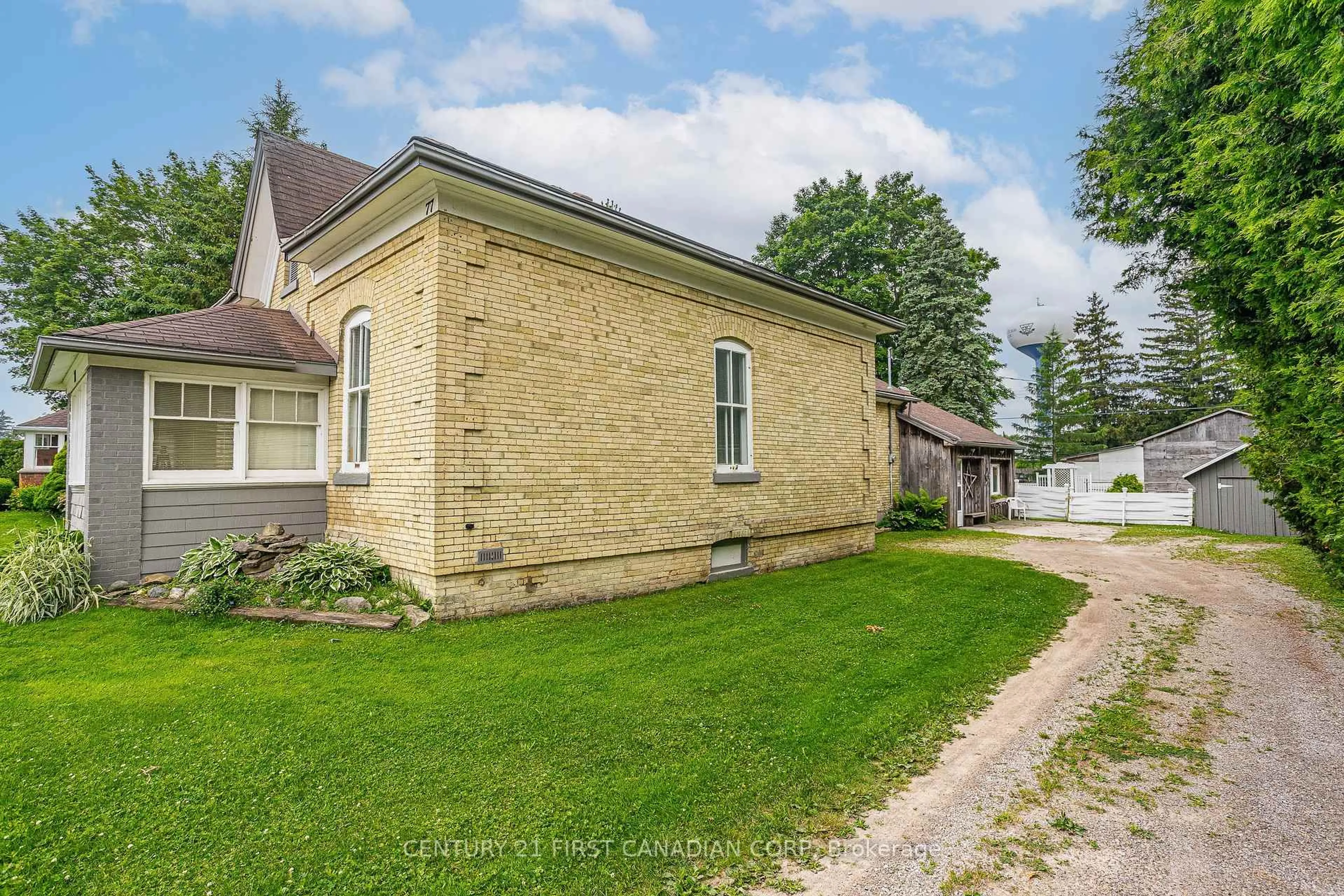 A pic from outside/outdoor area/front of a property/back of a property/a pic from drone, street for 77 Main St, South Huron Ontario N0M 1S3