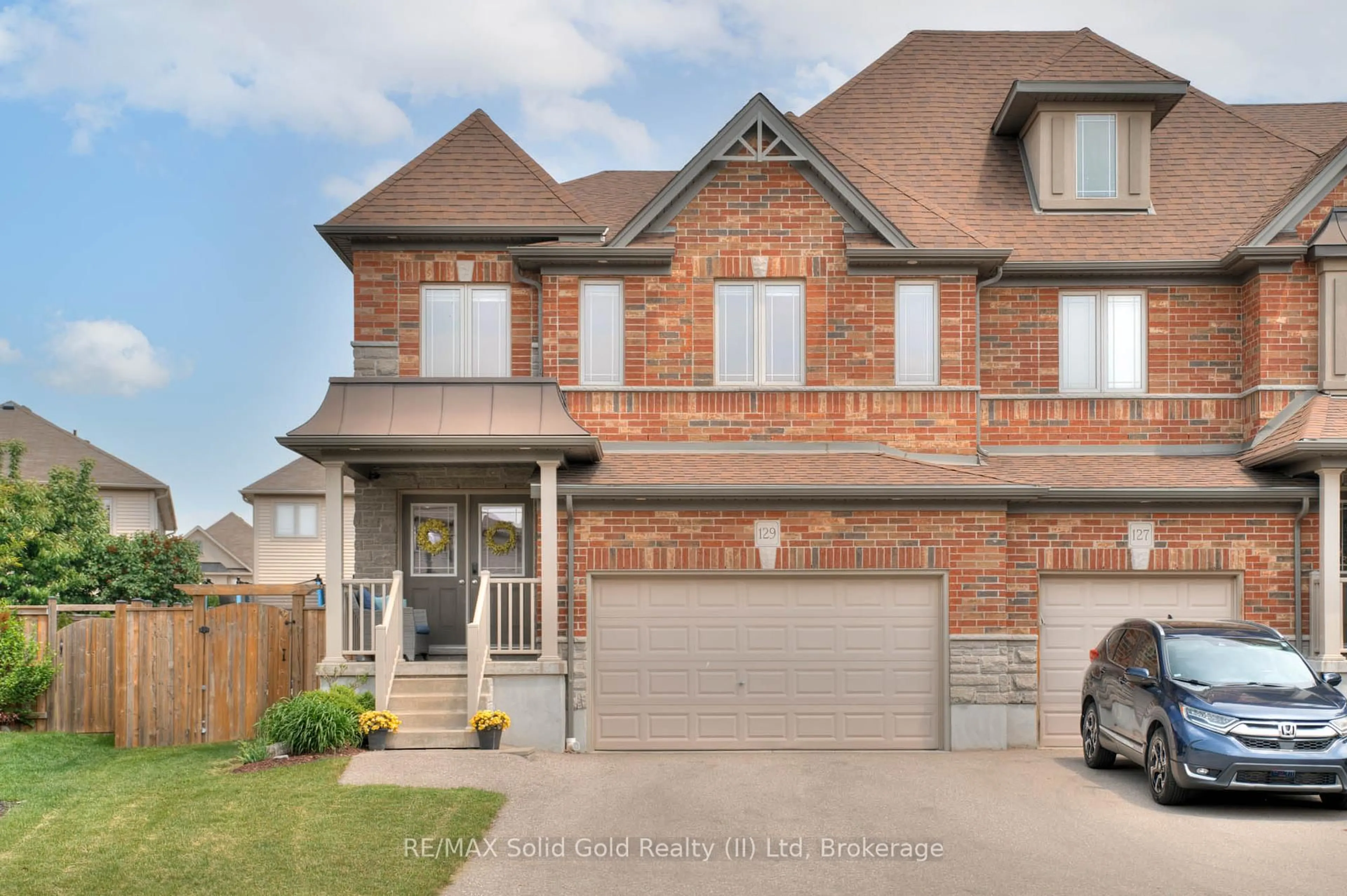 Home with brick exterior material, street for 129 Coopershawk St, Kitchener Ontario N2K 4J8