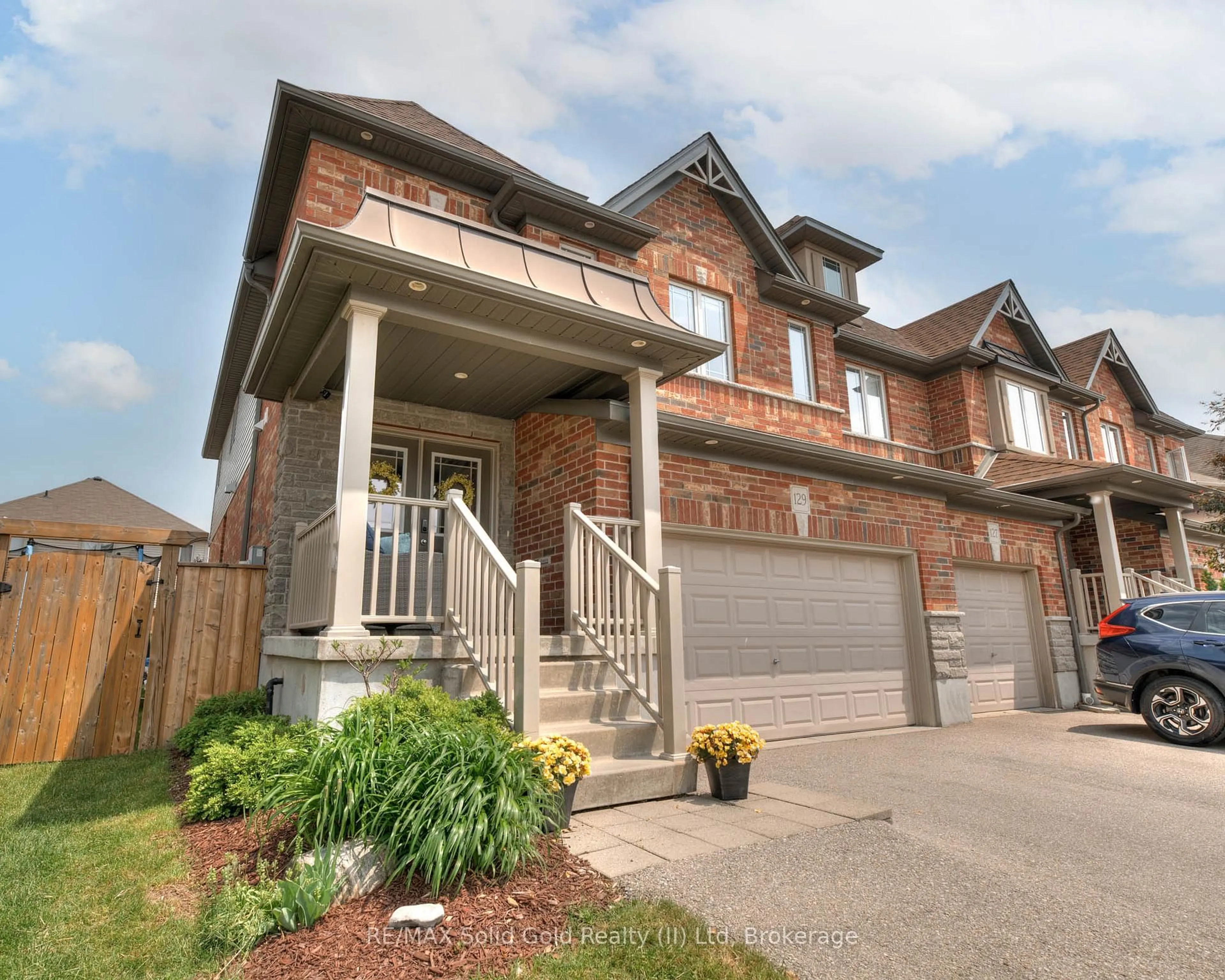 Home with brick exterior material, street for 129 Coopershawk St, Kitchener Ontario N2K 4J8