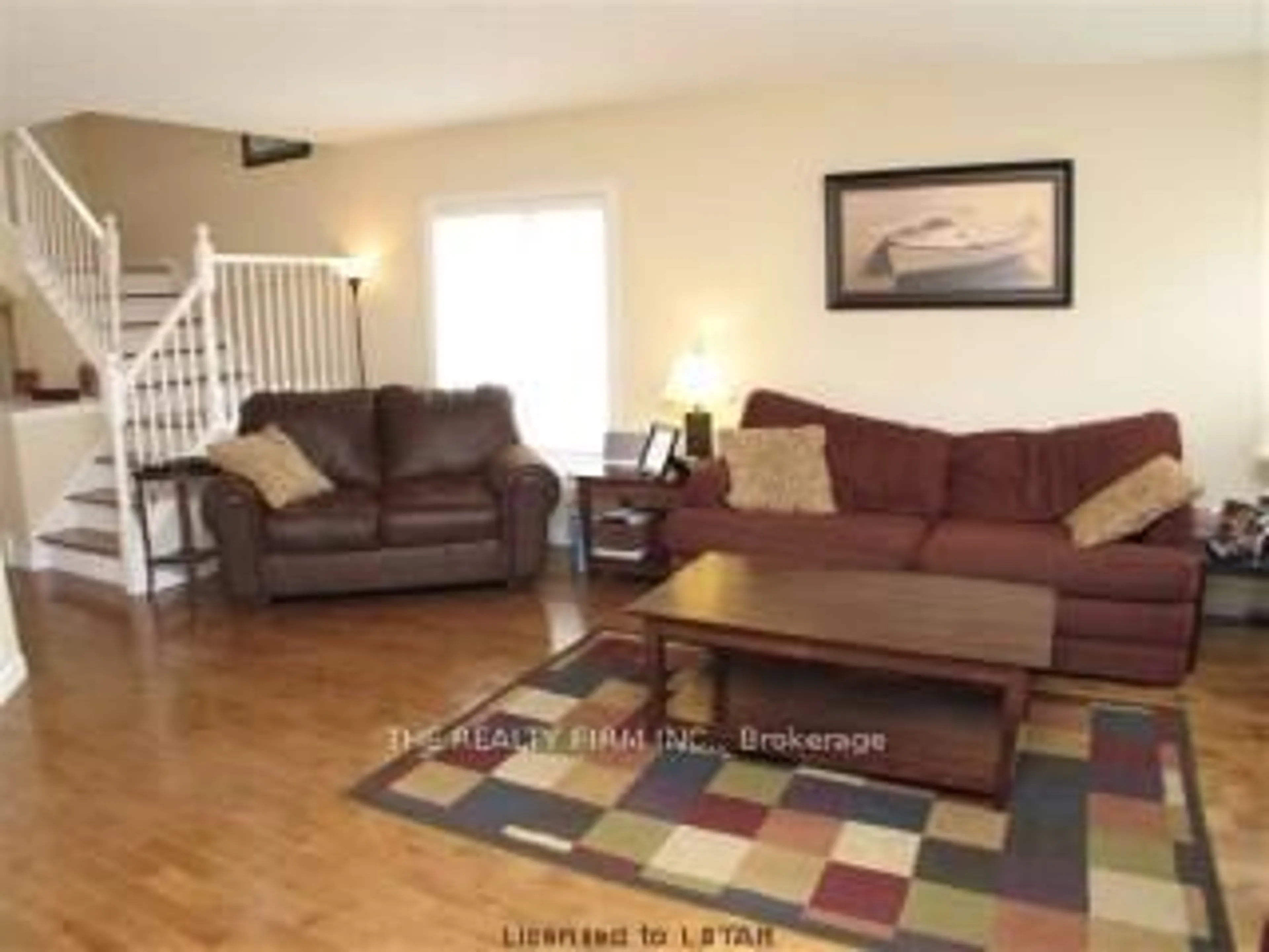 Living room with furniture, wood/laminate floor for 505 Blue Jay Dr #67, London North Ontario N5X 4K7