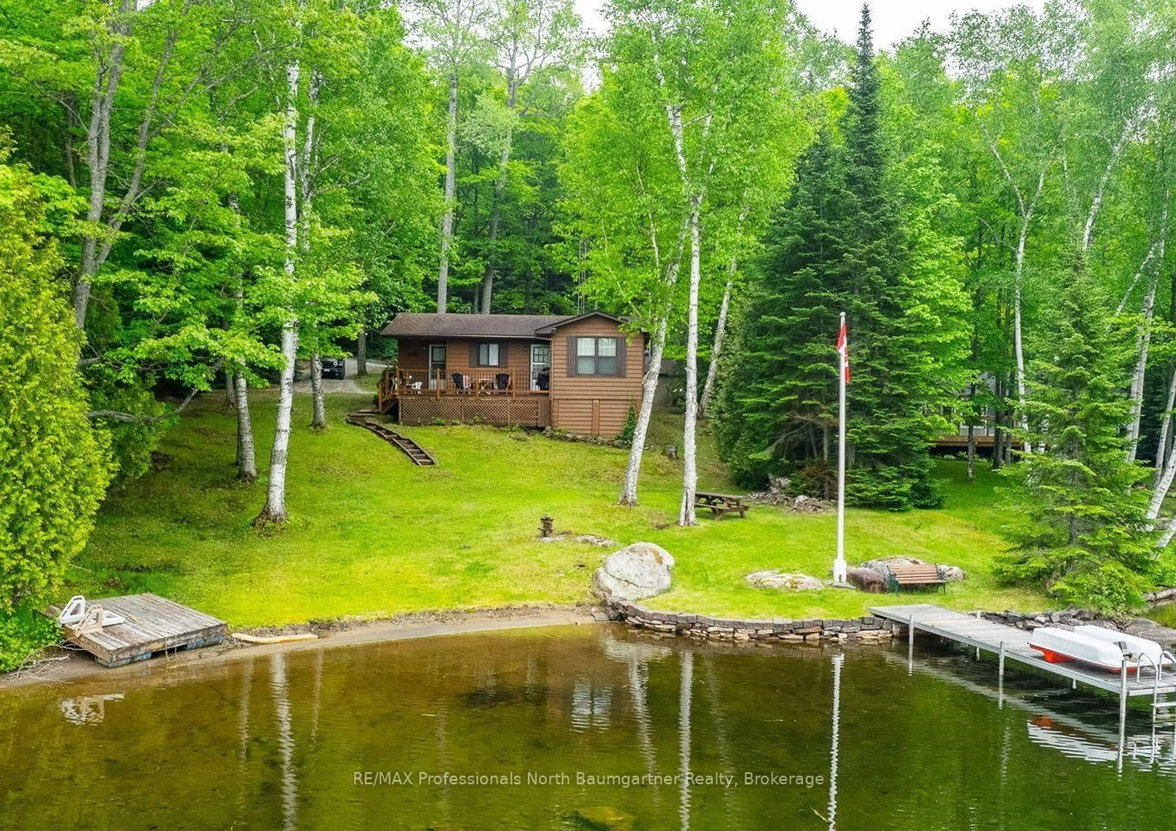 A pic from outside/outdoor area/front of a property/back of a property/a pic from drone, water/lake/river/ocean view for 1016 April Dr, Highlands East Ontario K0L 2Y0