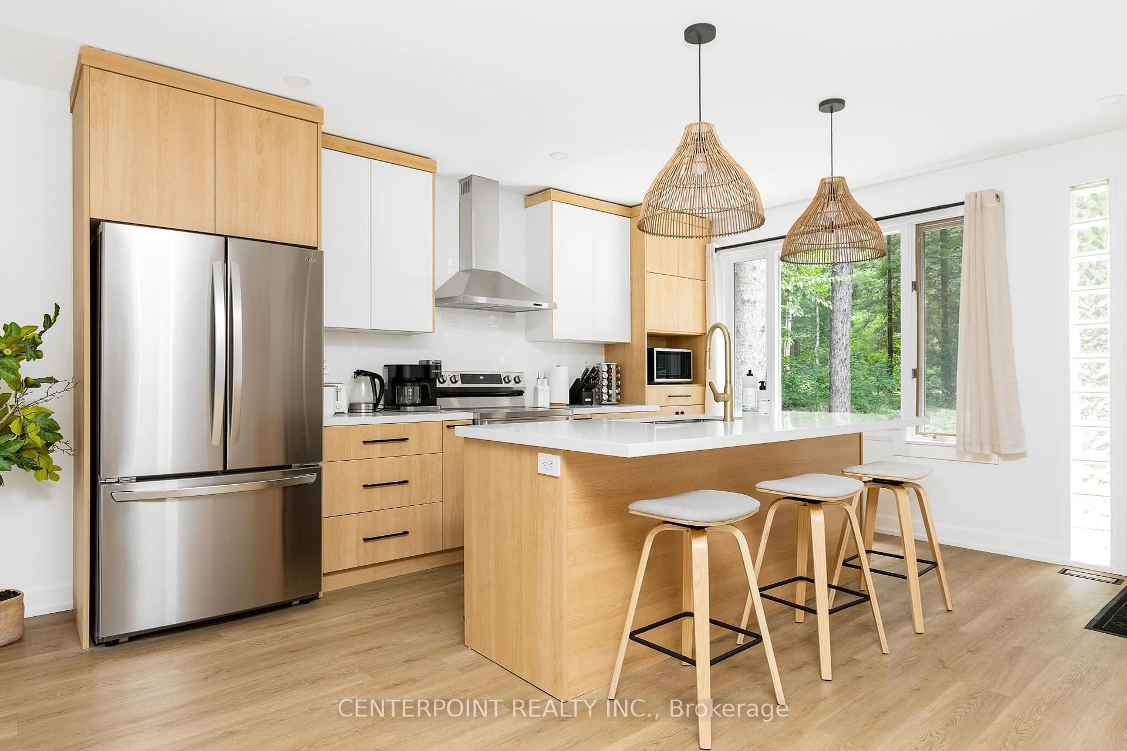 Open concept kitchen, wood/laminate floor for 214 Balsam Chutes Rd, Huntsville Ontario P0B 1M0