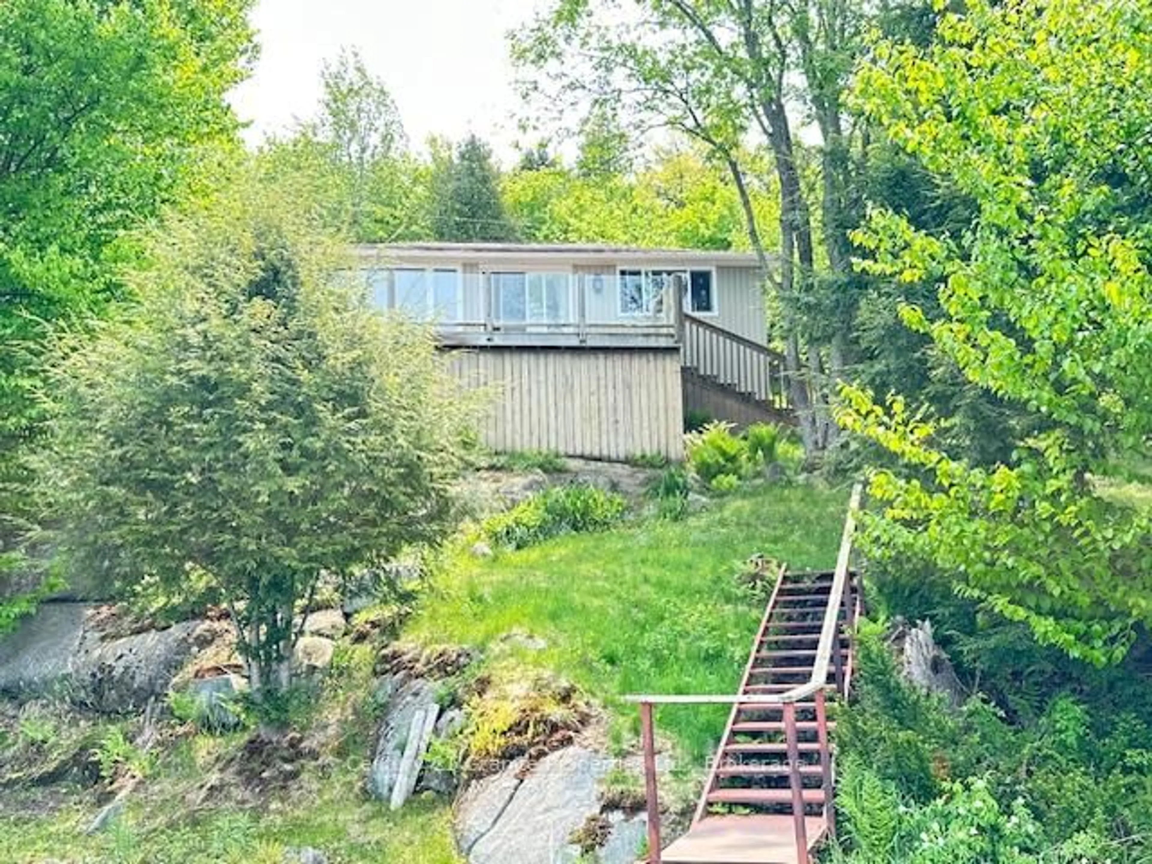 A pic from outside/outdoor area/front of a property/back of a property/a pic from drone, water/lake/river/ocean view for 4 Turtle Lane, McKellar Ontario P2A 0B4