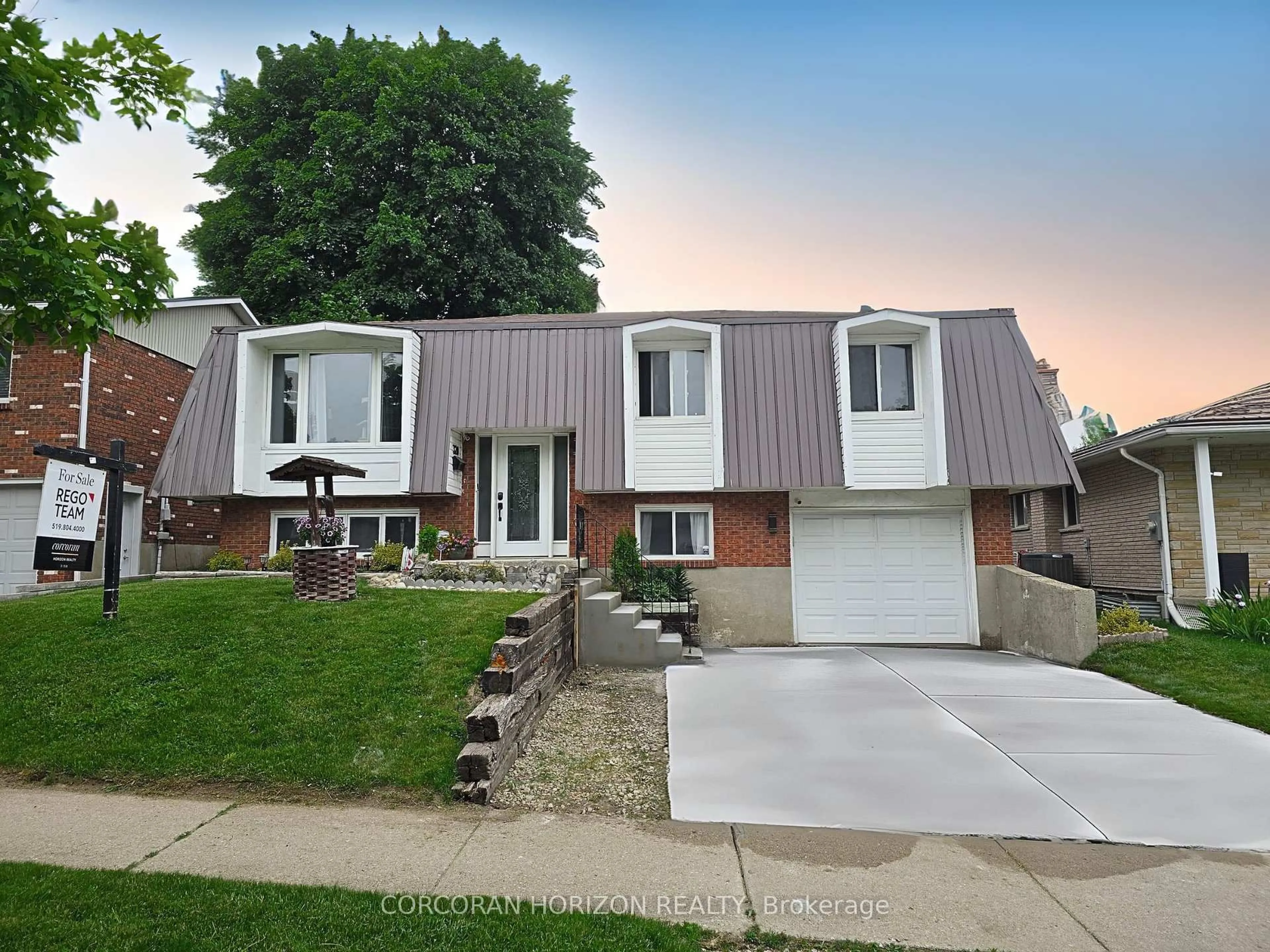 Home with brick exterior material, street for 320 Country Hill Dr, Kitchener Ontario N2E 2C2
