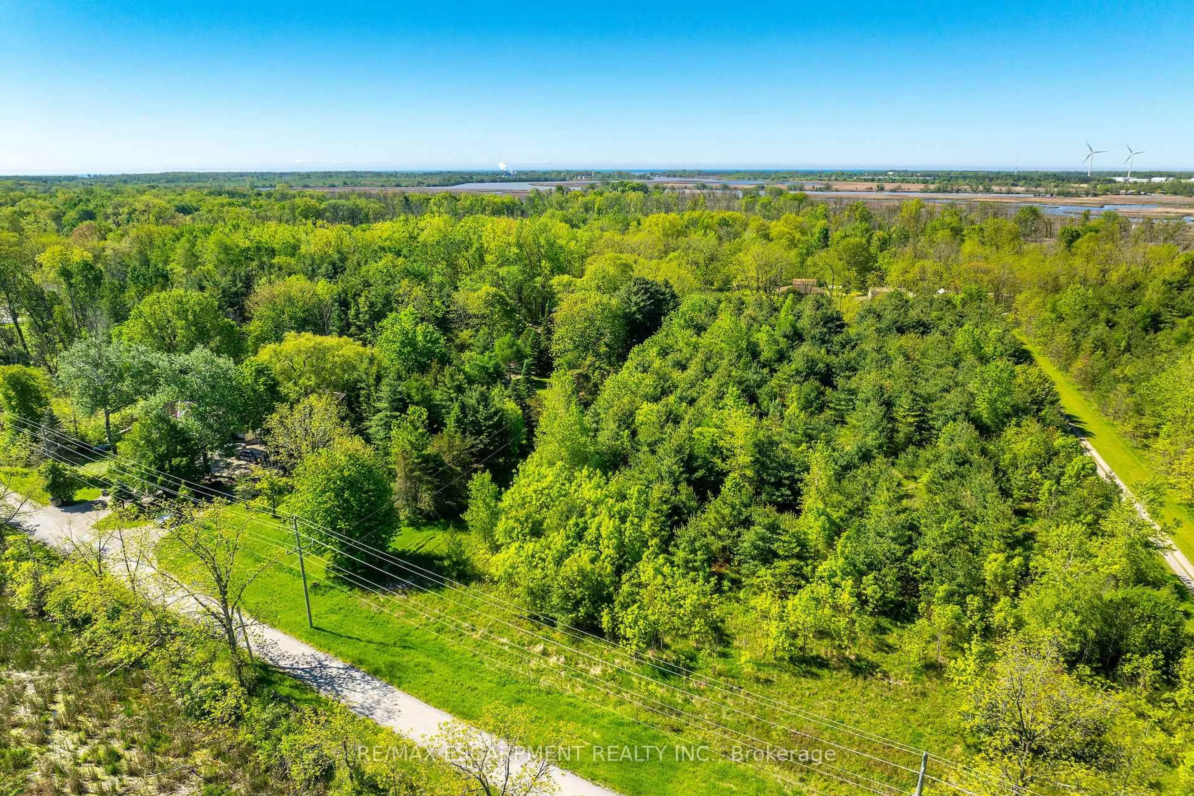 A pic from outside/outdoor area/front of a property/back of a property/a pic from drone, forest/trees view for 1172 North Shore Dr, Haldimand Ontario N1A 2W5