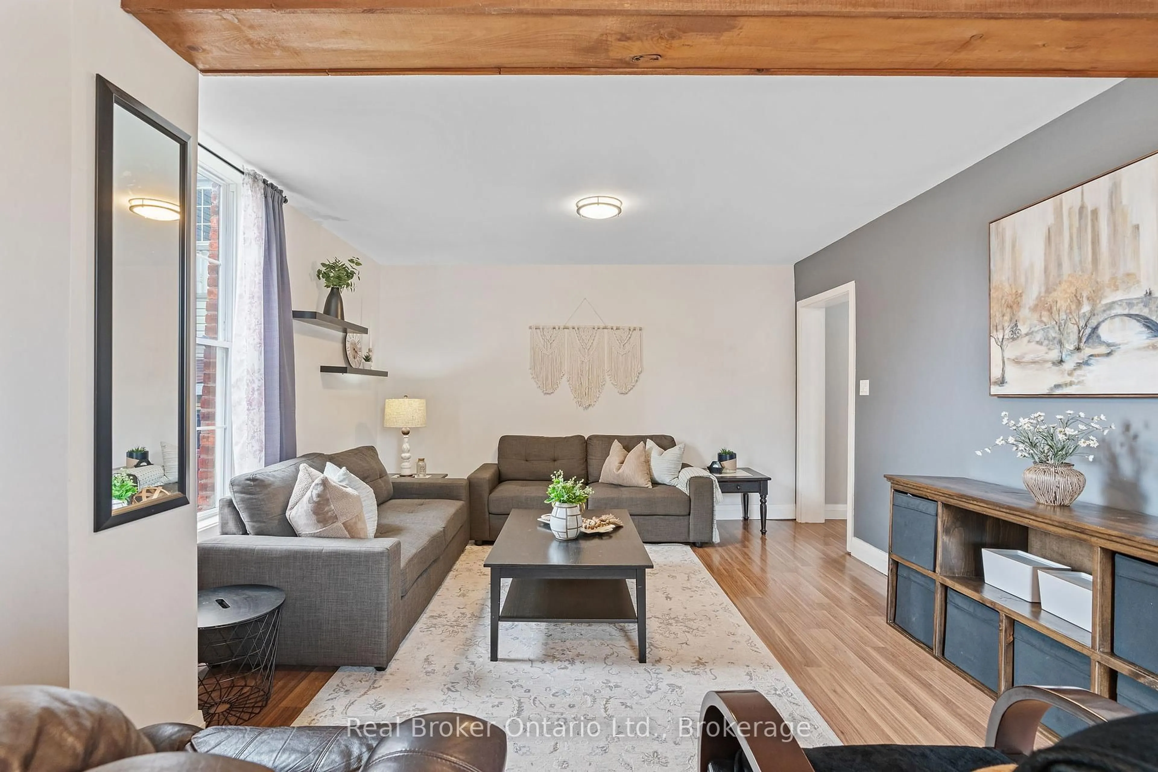 Living room with furniture, wood/laminate floor for 211 George St, Wellington North Ontario N0G 1A0