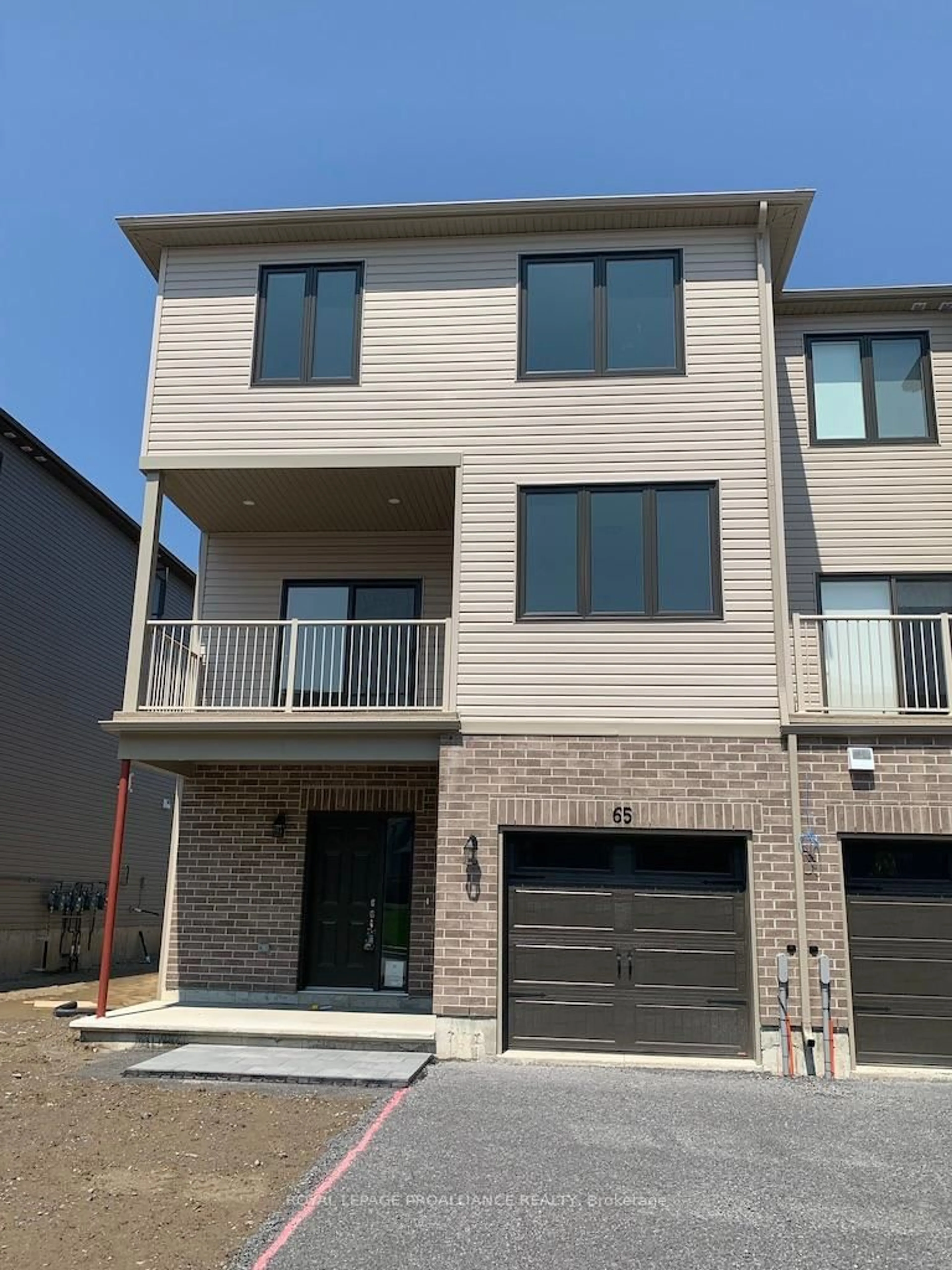 Home with brick exterior material, street for 65 Evans St, Prince Edward County Ontario K0K 2T0