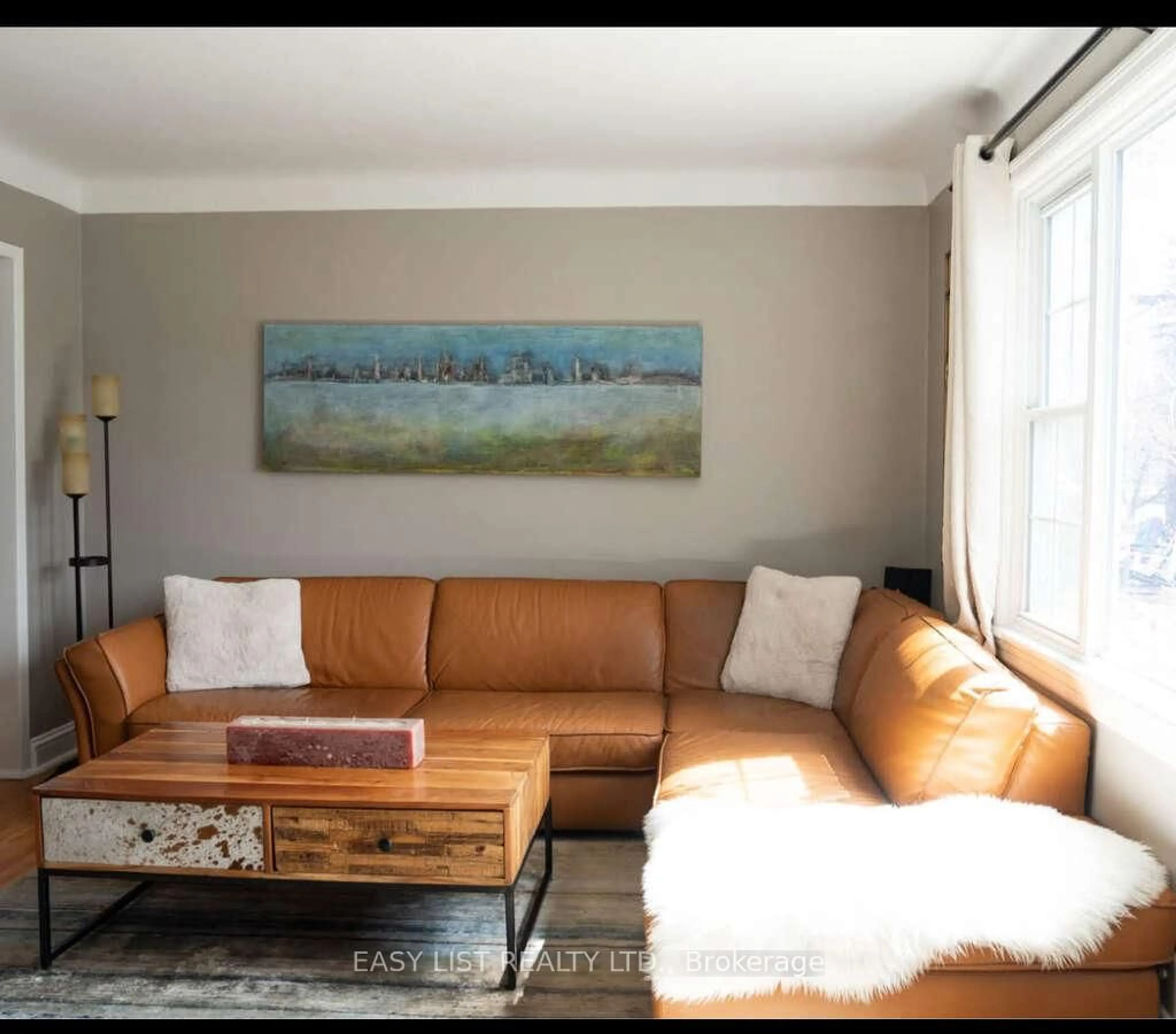 Living room with furniture, wood/laminate floor for 421 Greenwood Ave, Ottawa Ontario K2A 0X5