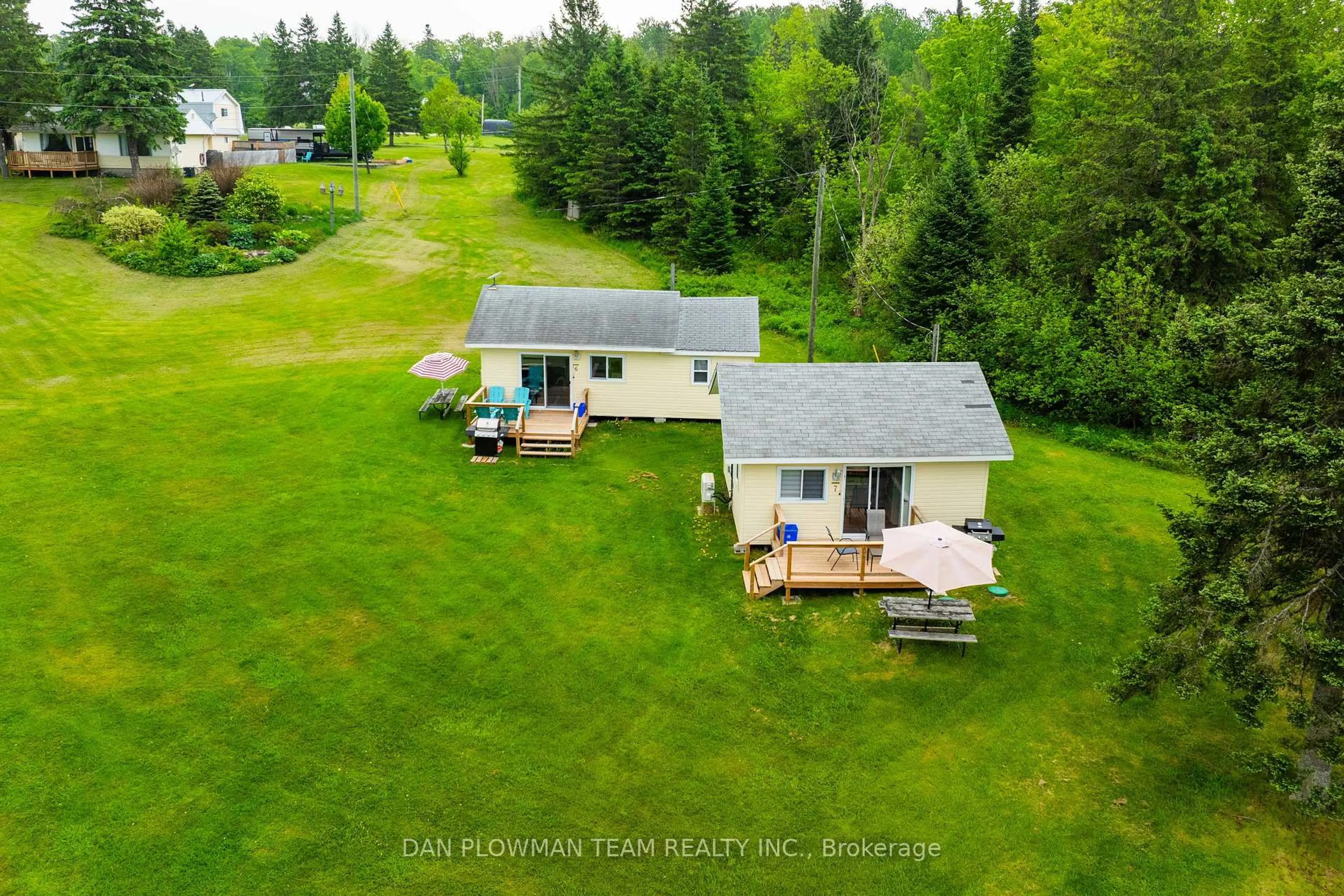 A pic from outside/outdoor area/front of a property/back of a property/a pic from drone, water/lake/river/ocean view for 184/189 Chapman Dr, Magnetawan Ontario P0A 1C0