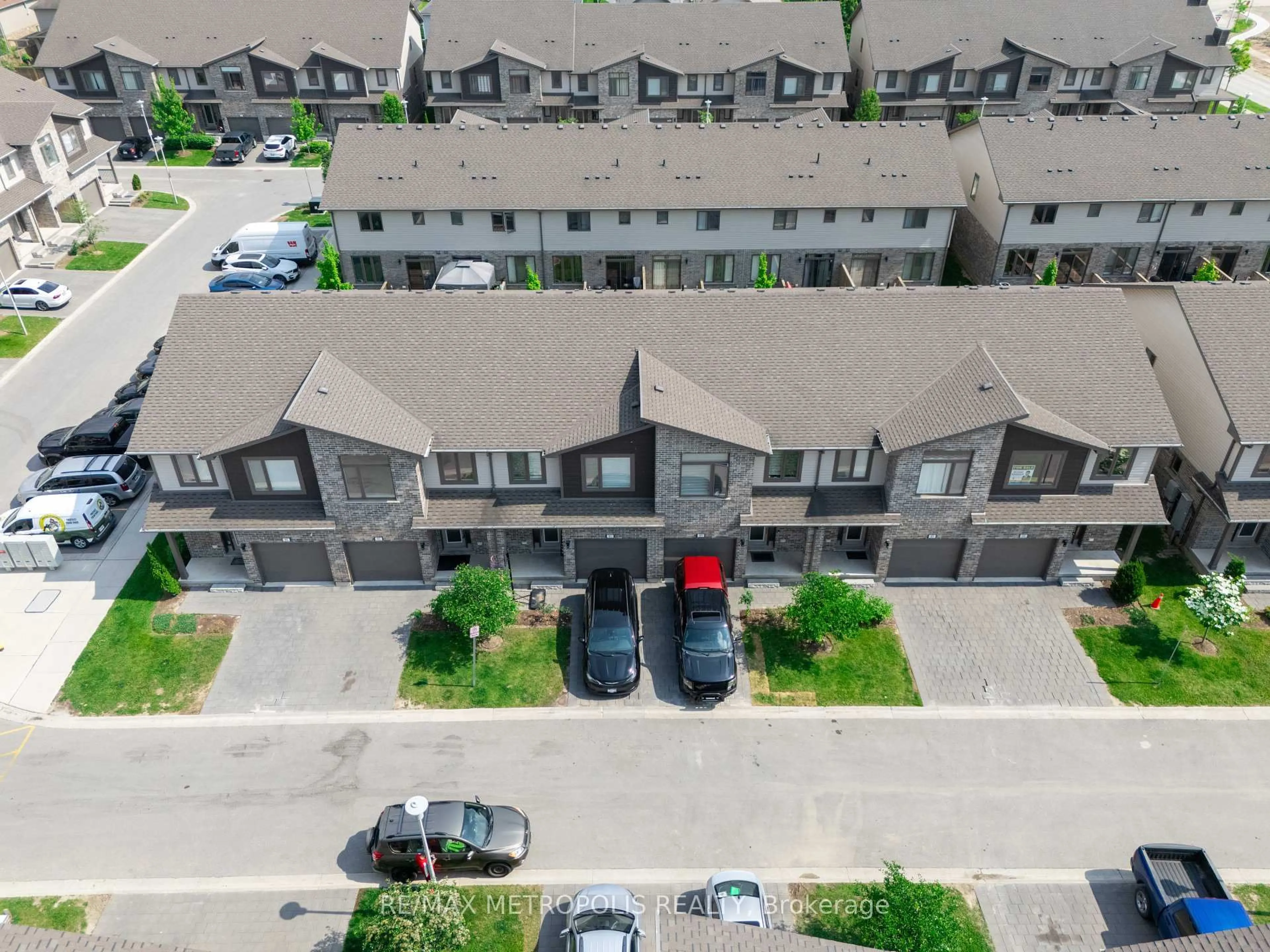 A pic from outside/outdoor area/front of a property/back of a property/a pic from drone, street for 1960 Dalmagarry Rd #93, London North Ontario N6G 5B1
